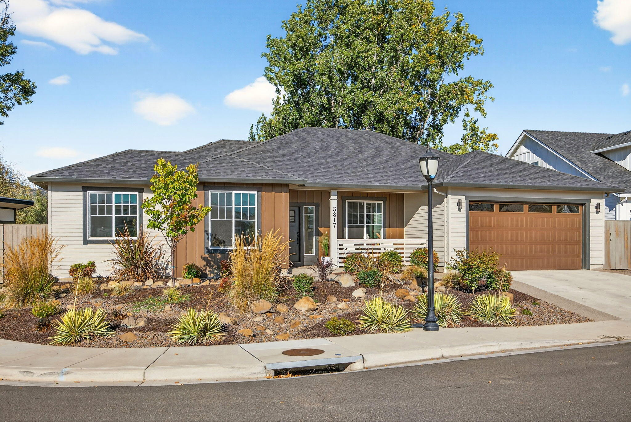 Welcome home! This stunning 4 bedroom 2 bathroom home was built in 2022 by Gary Ray and features all the modern bells and whistles. Step inside to find bright spaces, meticulously maintained hardwood flooring, and coffered ceilings. The kitchen is full of upgrades from the beautiful, granite countertops to the large island and stainless appliances. Outside you will find an inviting covered patio, low maintenance landscaping and a 132 sq. ft. finished detached studio with power - perfect for a home office, gym, or creative space. Located in a cul-de-sac of a desirable Medford neighborhood, it offers direct access to walking trails and is in close vicinity to top rated wineries and golf courses.