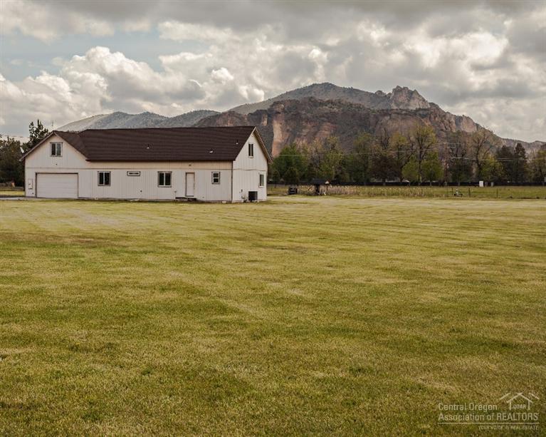 This must see, Beautifully maintained property w/irrigation, pasture, and large lawn is move in ready. Plenty of room to build your dream barn/shop & would make an excellent horse property. The location is just minutes from town & even closer to the famous Smith Rock State Park. Watch the rock climbers from your front window & the beautiful farm land across the street. This is the type of property you love & wished you owned on that Sunday driveby. The very comfortable home is awaiting your finishing touch.
