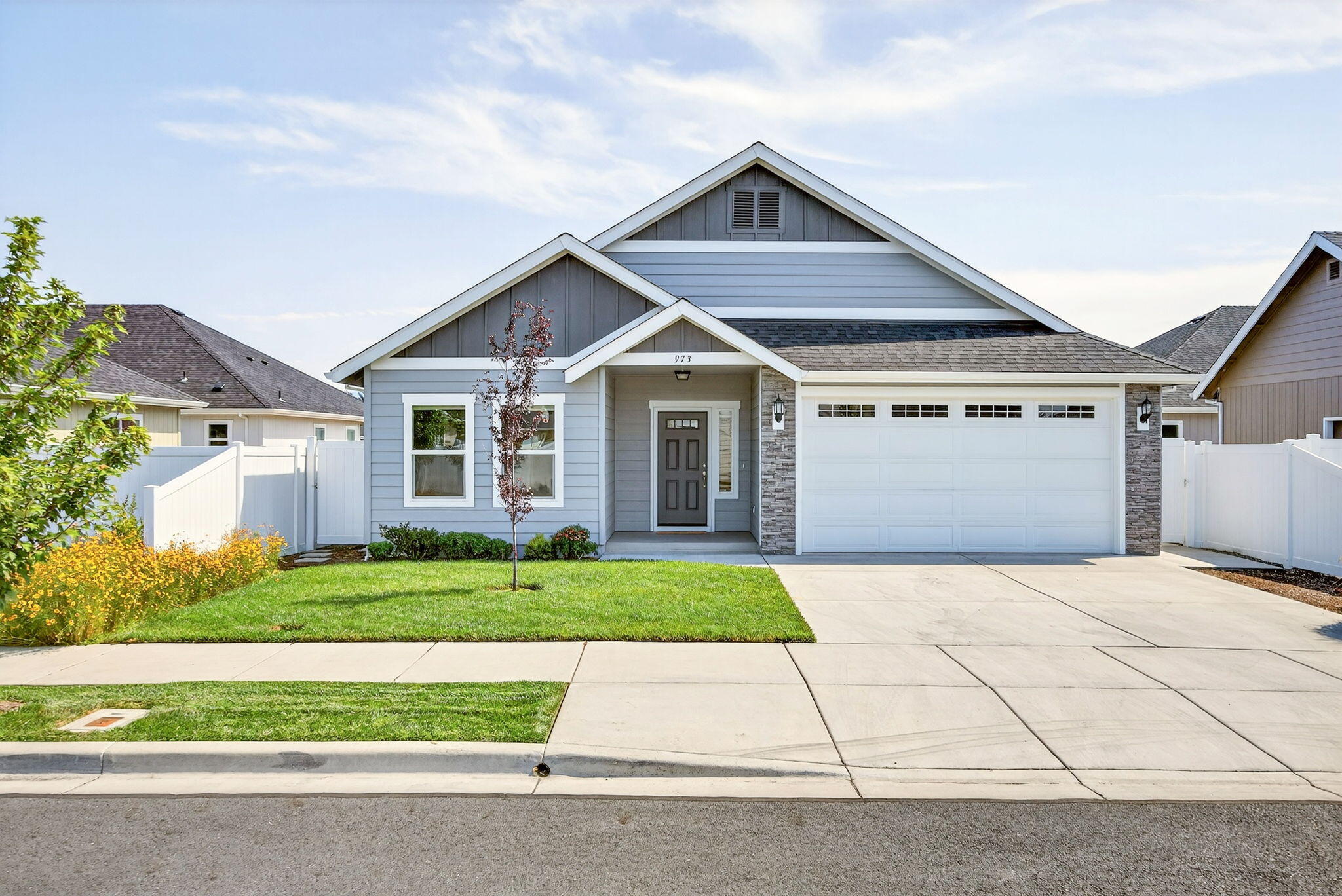 This home is move in ready. Just like NEW; this beautiful 3 bedroom, 2bath home has been lovingly cared for.  Open floor plan will be the gathering place for family and friends.  Kitchen with pantry, granite counters, island, SS appliances and beautiful floors.  Slider to the covered patio is a good place to look at the beautiful yard with raised garden beds, sprinklers and drip in front and back yard and fenced.  The work is all done for you. En-suite with walk-in closet, dual sinks and walk-in shower.  Featuring a split floor plan, one guest room with walk-in closet.  and FA gas heat and Central A/C. Attached 2 car garage is 460 sf.  Convenient location close to hospital, shopping and schools.  Put this one on your list to show,