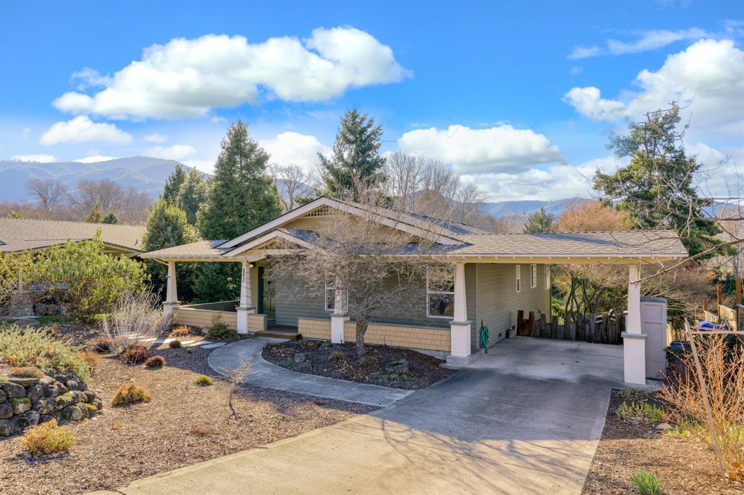 What a rare Ashland GEM! This spacious home is situated in town on a beautiful and useable .91 acre lot with Ashland Creek frontage. You will want to spend hours outside taking in the orchard, raised garden beds, large in-ground swimming pool, covered patio and all the stunning landscaping. The home is super inviting with an open and vaulted great room with gleaming hardwood floors, complete with a Jotul woodstove and plenty of space for entertaining. The kitchen was remodeled and has pulled-out storage, tile counters and backsplash and plenty of natural light.The main floor offers two good sized bedrooms, a full bath and laundry. Downstairs you will find an oversized master wing with walk-in closet, shower, soaking tub and direct access to the pool and outdoor paradise. Don't miss the detached shed as well as the good sized workshop, conveniently adjacent to a tremendous amount of partial basement storage. Plenty of off-street parking and very close proximity to downtown Ashland.