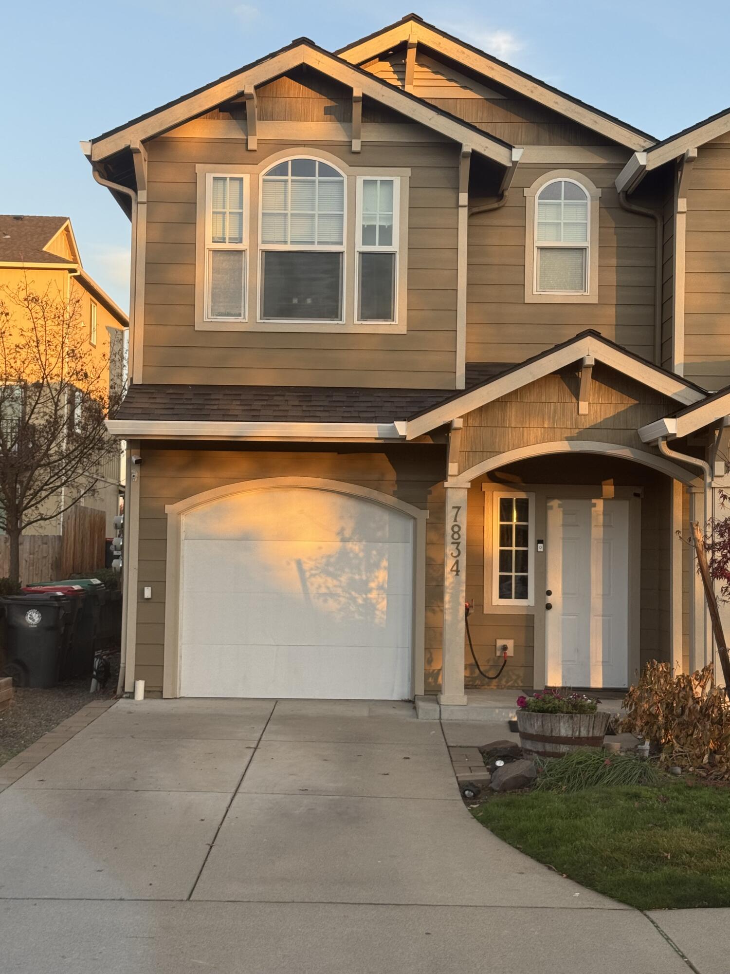 This is it. USDA, FHA & VA Financeable. The Beautiful end unit townhome is move in ready!! The spacious open floor plan offers over 1525 SF with 3 bedrooms and 2.5 bathrooms. Newer flooring installed downstairs and refreshed paint throughout the home. Downstairs bathroom has a cute barn board feature wall, while the upstairs main bathroom was fully remodeled in 2023 with custom countertop and vinyl tile. The master bedroom has two large closets and double vanity sinks. Laundry is located upstairs along with an oversized linen closet. The slider leads to a fully paved and fenced backyard oasis with raised garden beds. Side yard completely graveled and partially fenced with potential room for a storage shed. HOA covers water, sewer and front yard landscaping. Sale includes remaining transferable home warranty and carpet credit