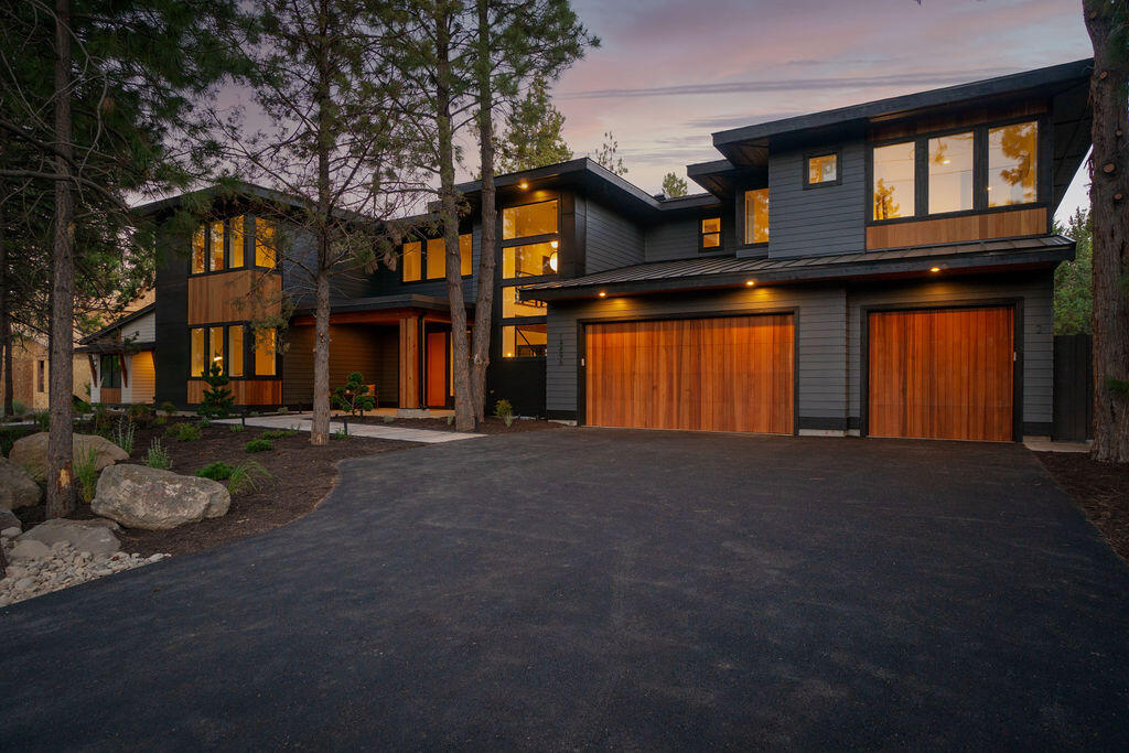 BRAND NEW Custom Home w/ ADU in SW Bend's desirable Woodriver Village! This home features open layout living w/ white oak hardwood floors, 20' ceilings, bifold doors opening to the covered back patio, and an incredible chef's kitchen with waterfall island and butler's pantry. The main level also highlights the stunning Primary & Guest En-Suites with 9' ceilings, powder bath, and laundry/mud room. Past the mudroom lies the oversized 3-car garage - perfect for storing your gear to enjoy all the activities Central Oregon has to offer! The second level includes a foyer which would be perfect flex space for lounging, office, or study as well as 2 more bedrooms w/ bathroom. To top it off, this luxury property also features an attached 700 sq. ft. 1 bedroom, 1 bathroom ADU w/ separate entrance to allow maximum privacy. The Woodriver Village community is also conveniently located near Deschutes River Trail, Farewell Bend Park, Mt Bachelor, Old Mill District, Hwy 97, and Century Drive.