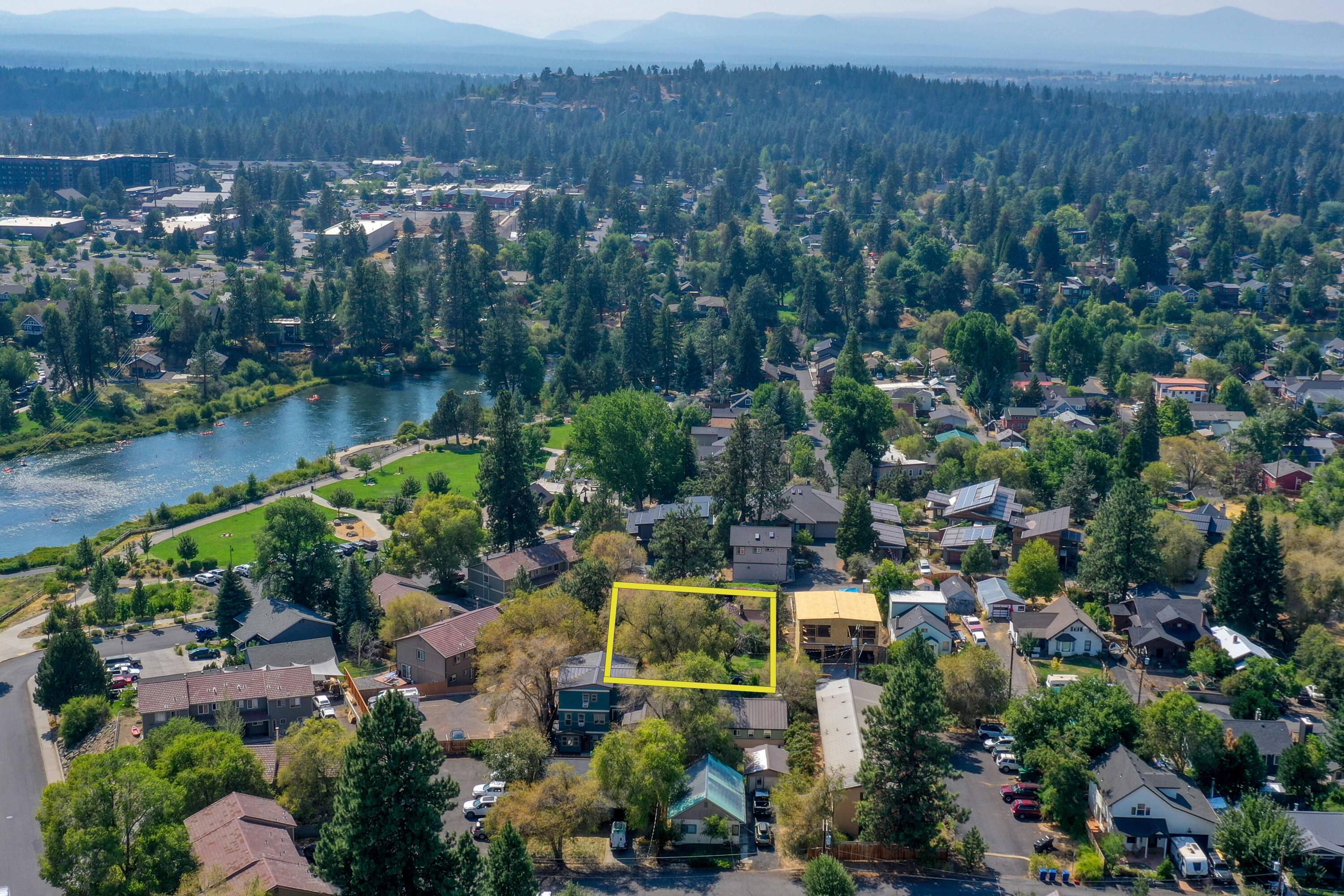 **Check out this Amazing Investment Opportunity!!  These two (2) lots in the heart of Old Bend totaling .33 acres, near the Old Mill and steps away from the Bend Whitewater Park are ready for your imagination. The main house was built in 1919 and has an expansive deck with Cascade Mountain and Deschutes River views including the Bend Whitewater Park.  Tranquil and peaceful in the heart of all the downtown action, this location can only be described as magical year round.  Buyer responsible for due diligence with the City of Bend regarding their plans for this land with limitless potential in RM zoning and alley access.