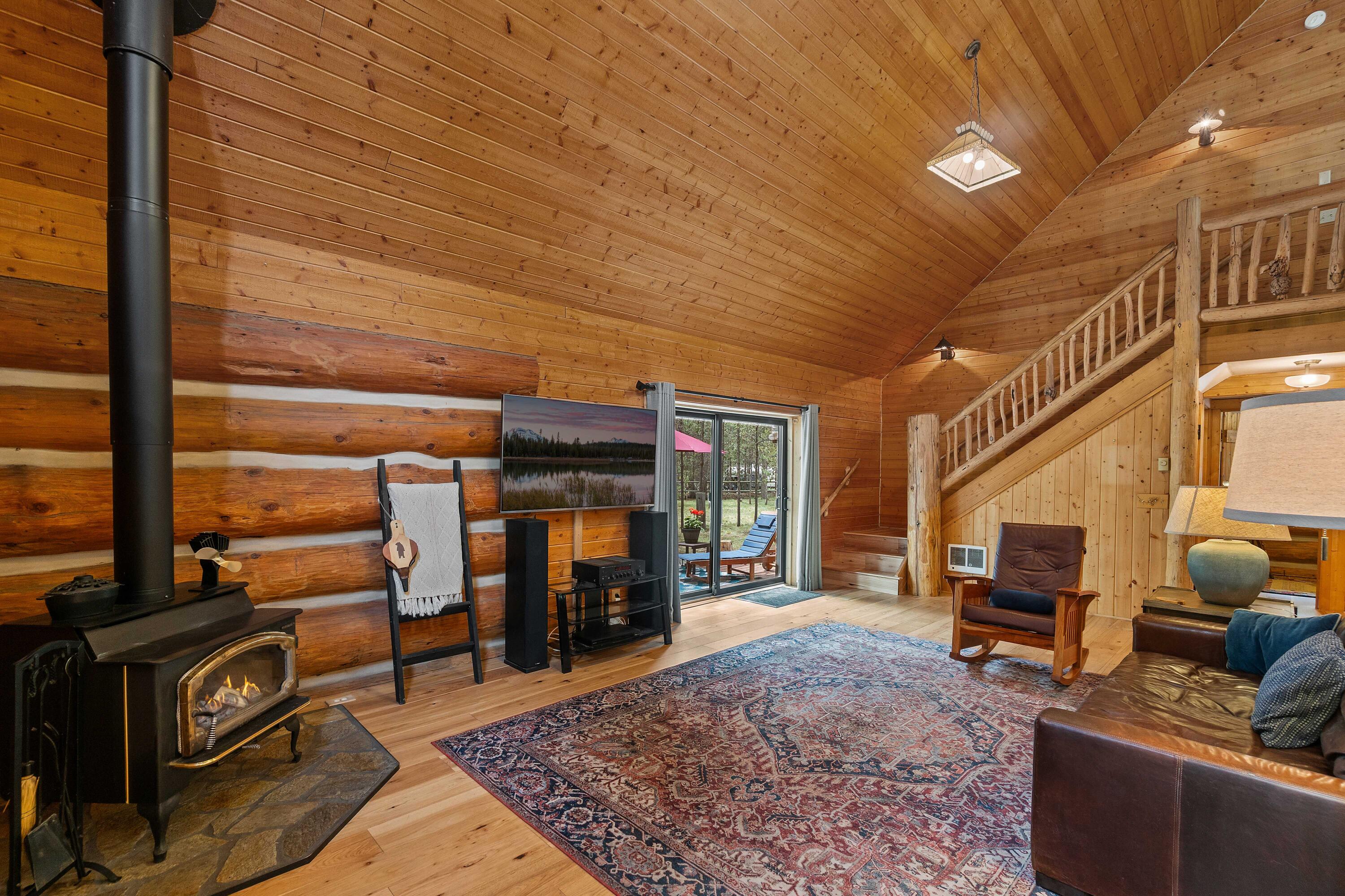This distinctive Oregon Water Wonderland home is filled with artistic flourishes and rustic touches that enhance its connection with this remarkable neighborhood that provides access to the Deschutes River & is just minutes from the endless National Forest land just beyond the neighborhood. Enjoy cool summer days on the wrap around deck & cozy evenings in the spacious great room with towering wood lined ceilings. A roomy kitchen includes a generous expanse of granite counters with tile backsplash & stainless steel appliances. A large open loft adds plenty of extra living space & leads to a light-filled primary suite with wood lined vaulted ceilings, walk-in closet & bathroom with separate tub & tile shower. On over half an acre, this property is fully fenced with 2 gated entries & a large garage/shop, ready for all your projects. Immersed in the beauty of Central Oregon, this home is perfect for seasonal or year-round living, just 6 miles to Sunriver and 24 miles to Mt. Bachelor.