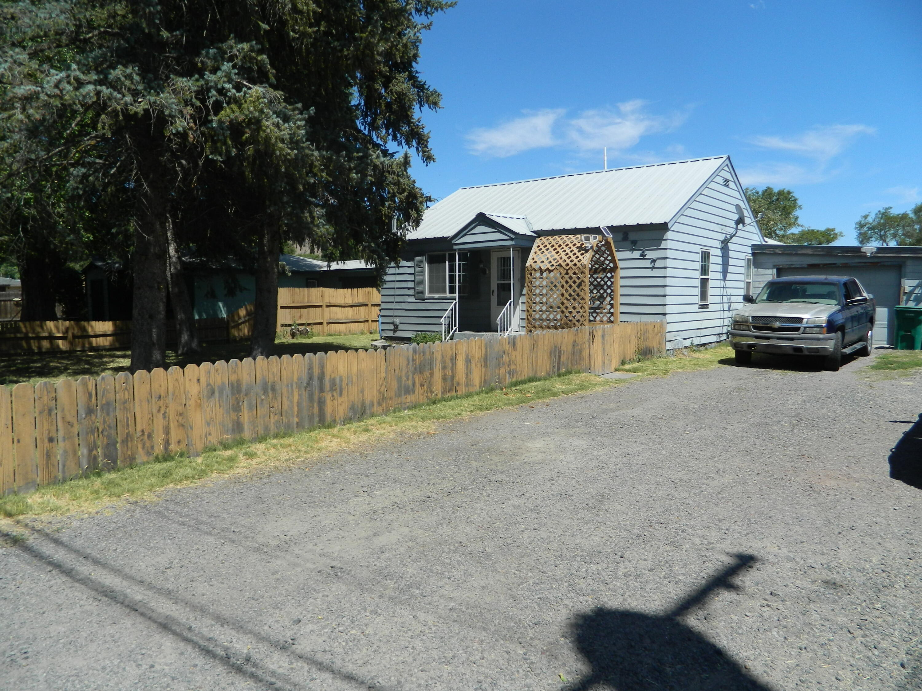 This 3 bed 2 bath home has a lot to offer than most. Along with an 1104 sq ft home, there is a long 1 car attached garage with an abundant of storage, there is a 2 bay shop, 3 bay equipment carport and covered RV structure with power to it. All of this sits on .48 acres. The kitchen has been updated and it is a split floor plan. This house lives very well for the square footage