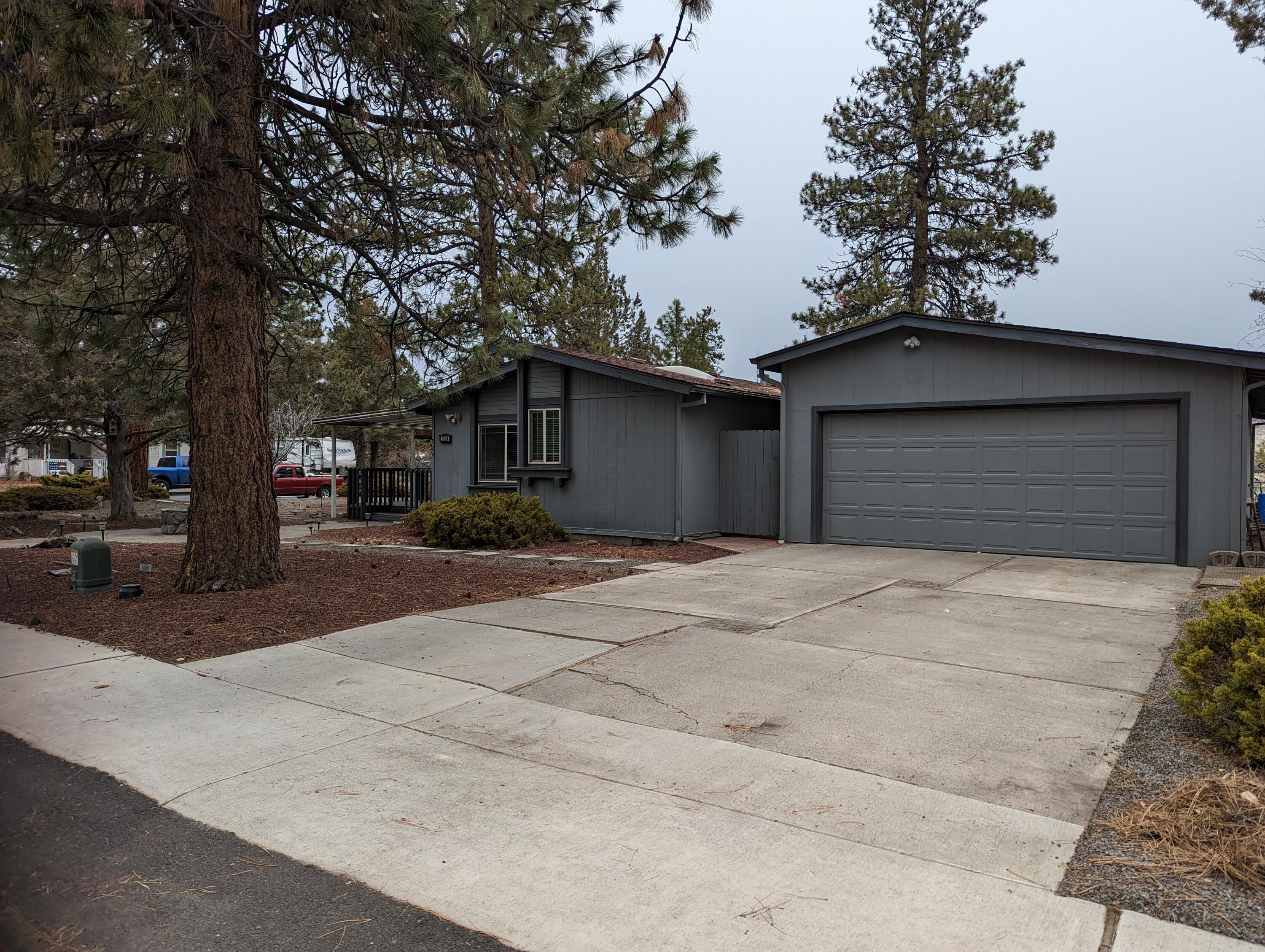 Quiet and peaceful home in established neighborhood with mature trees! Access to Larkspur Community Center and Senior Center is close by down Castlewood Drive. Large corner lot with RV parking in the back, fenced backyard with deck and firepit. Inside is a cozy vaulted living room with pellet stove, vaulted primary suite and two additional bedrooms and guest bath. Large kitchen with new appliances and an incredible amount of cabinets. Large dining area in kitchen. Exit out the huge mud room to a covered breezeway to the incredible 4 car tandem 840 sqft garage with bult in cabinets. Welcome Home!