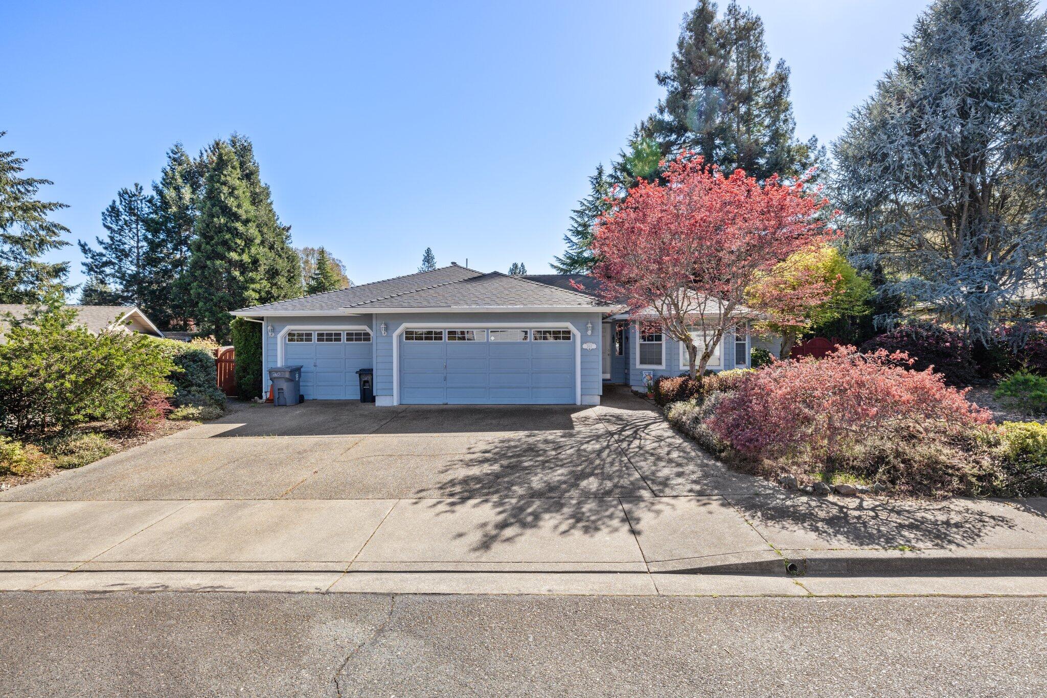 Welcome to this spacious, well laid out 3 bedroom, 2 bath single level home.  The kitchen, dining and main living room have an open concept where natural light abounds.  Upon entering you'll notice the front room that is currently being used as a library and reading room.  The primary bedroom features a beautiful en-suite bathroom w/ beautiful tilework and a walk-in closet.  The peaceful, private yard has beautiful flowers and mature trees & shrubs, providing a cooler space for entertaining on hot summer days.  There is also a 3 car garage with plenty of parking and storage.