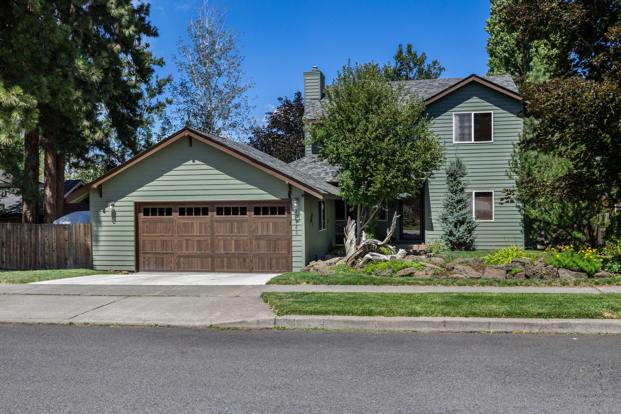Beautifully updated home in an ideal, adventure-ready Bend location! Nearly every surface and system has been refreshed: new flooring, paint (interior/exterior), garage door, vanities, toilets, kitchen sink, appliances, water heater, and more - mostly completed in 2022. New hot tub (2024), storage shed (2023), serviced HVAC (2025), and a charming wraparound covered porch perfect for relaxing year-round. Roof inspected and in great shape. Located on a quiet street with no through-traffic, friendly neighbors, and space for kids and dogs to roam. Less than 1000 ft to forest trails, sledding hills, swimming spots, river access, and the Deschutes River Trail leading to the Old Mill and Downtown. Conveniently near highly rated Pine Ridge Elementary. No HOA, yet the neighborhood is clean, well-kept, and full of outdoor charm. A rare find within Bend's natural beauty!