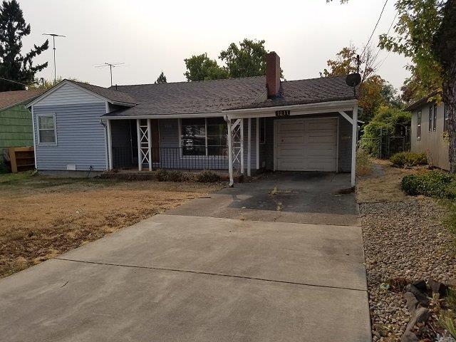 Cottage home with large yard and shop for extra storage. Lots of room in fenced back yard for kids or pets. Quiet neighborhood with plenty of street parking. Sit by the fireplace on those cold Winter nights.