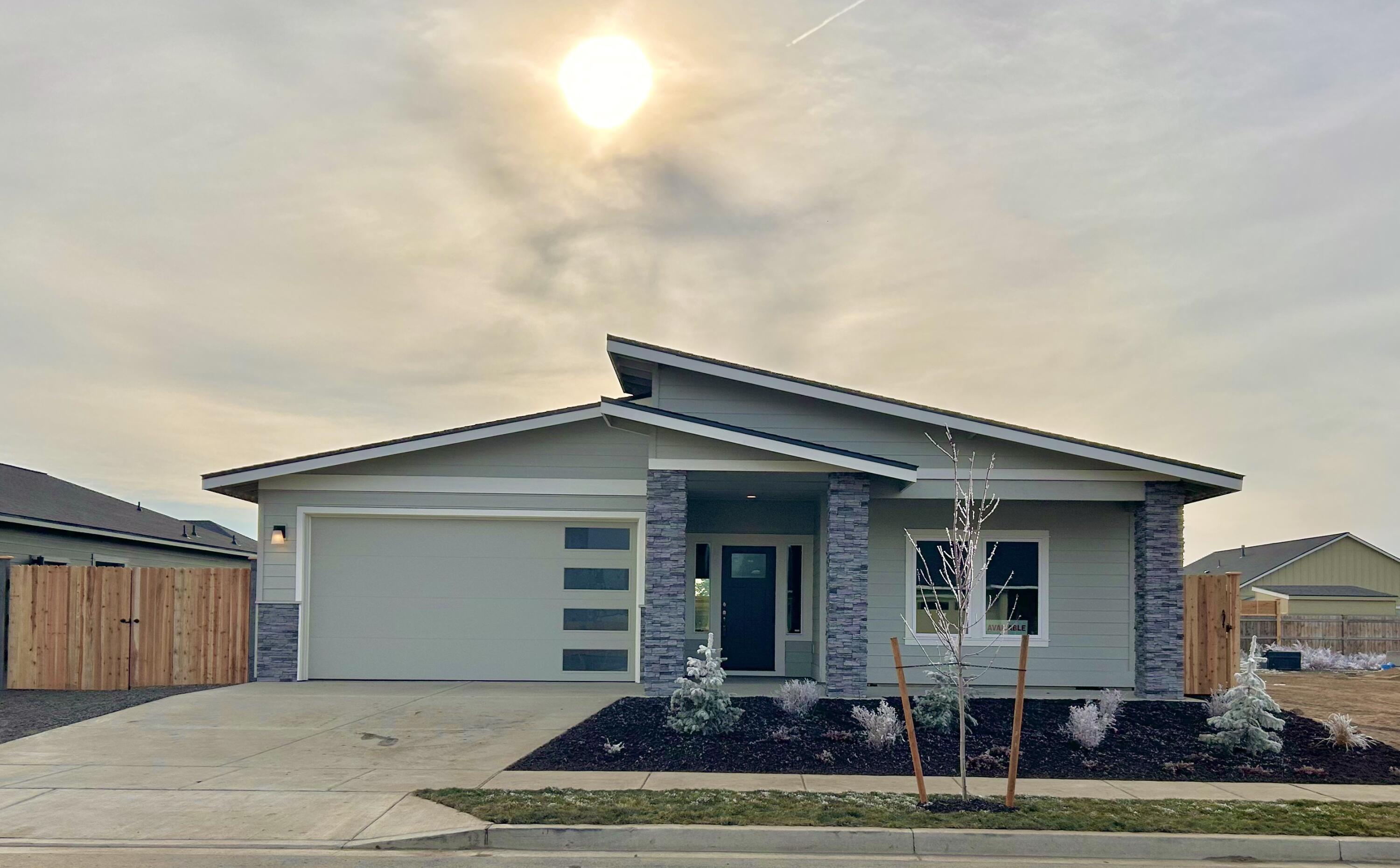 Completed & move-in ready! Lot 29 features the Juniper floorplan w/ 1,749 sf of single-level living; 3 bdrms, 2 baths, 2 car garage & side yard for RV/boat/toy parking. Primary bdrm features an XL walk-in closet and full bath w/ dual vanities & tile shower. Great separation from 2 guest bedrooms sharing a full bath. Entertain in your kitchen w/ SS appliances, pantry, full height tiled backsplash, soft-close cabinets, extensive slab quartz countertops opening to vaulted dining area and great room w/ gas burning fireplace. A spacious utility/laundry room too. Durable laminate plank flooring thru-out & carpeted bdrms. Covered back patio, fenced yard & landscaping w/ sprinklers & entrance gate to side yard parking. Upgraded finishes, tankless water heater & A/C included! Pro photos coming soon. *Floorplan subject to change.