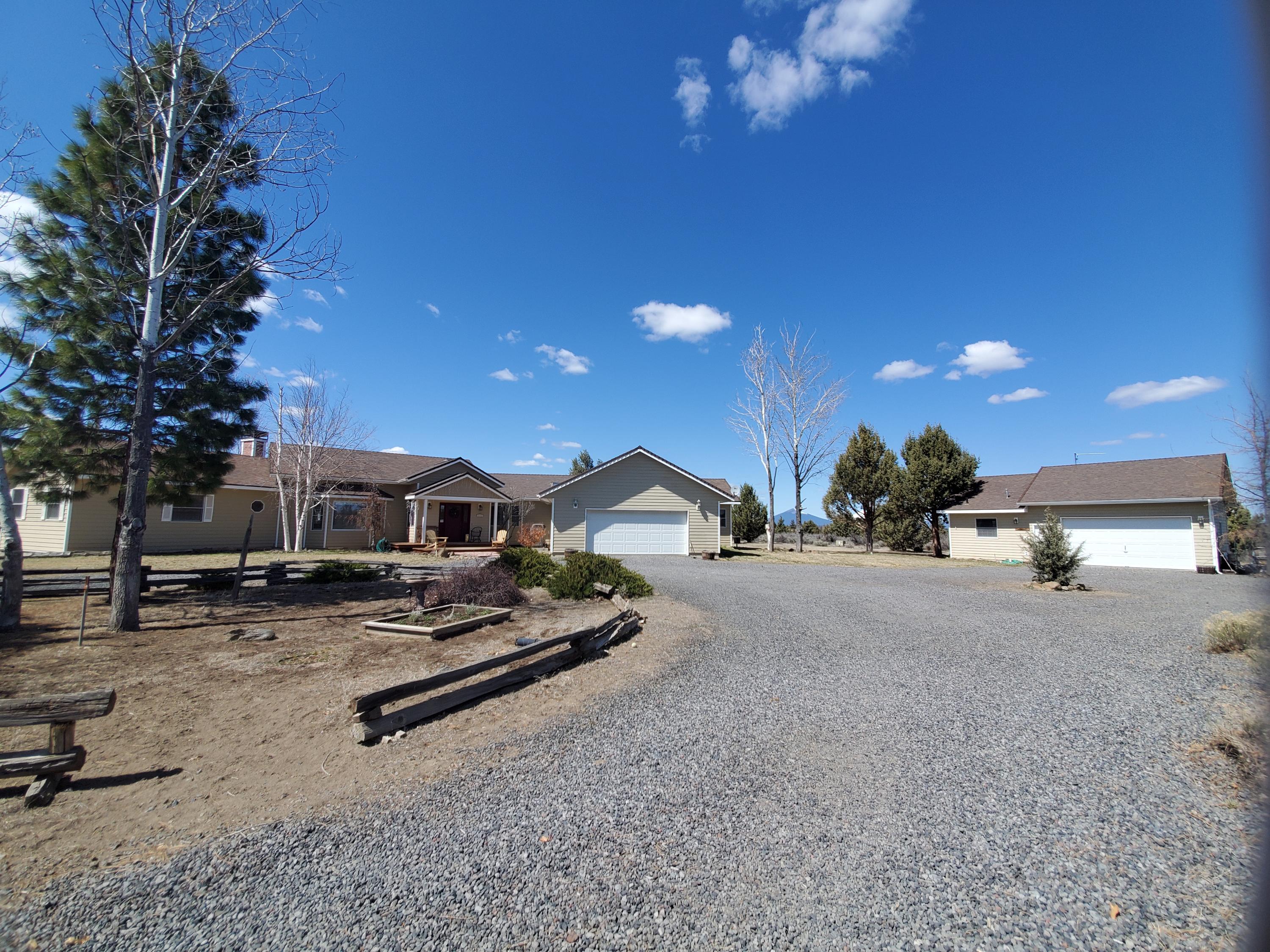 Great views! This is an estate sale and wont last long. Large home with open floor plan and tall ceilings. Additional detached garage/shop with guest room. Home needs a little TLC but has loads of potential. Easy access off main roads and close to Sisters.
