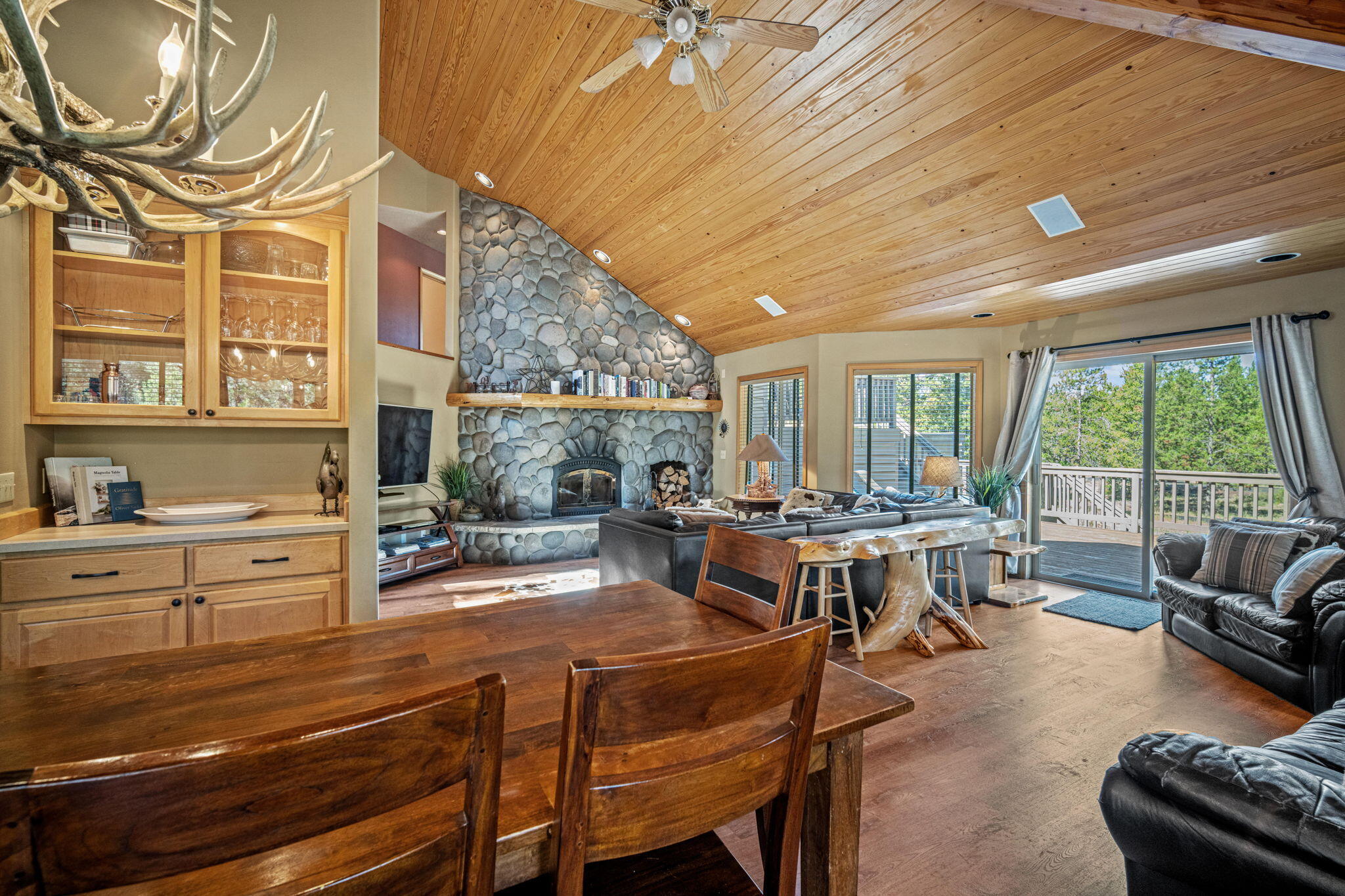 Sit in front of a large rock fireplace and enjoy this exquisite multi-level home built by the owner and sold furnished; the 6-bedroom, 3.5 bath custom home is designed to give everyone privacy and still have multiple common areas to gather and enjoy all that Sunriver has to offer. A pool room adds an extra entertainment area. Seasonal mountain view on one acre site. Close to the river, Woodland Golf Course & Pro Shop, Mc Divot's Cafe, the SR Private owners pool, tennis and pickleball courts; you can play all day and still have the Village & bike path system to explore.  You will appreciate the 1-acre location on Sarazen as this home sits on the very west side of the lane facing the mountain. Two stunning Oregon antique pieces included in sale. Timberline snow stake at entrance and sled in pool room.