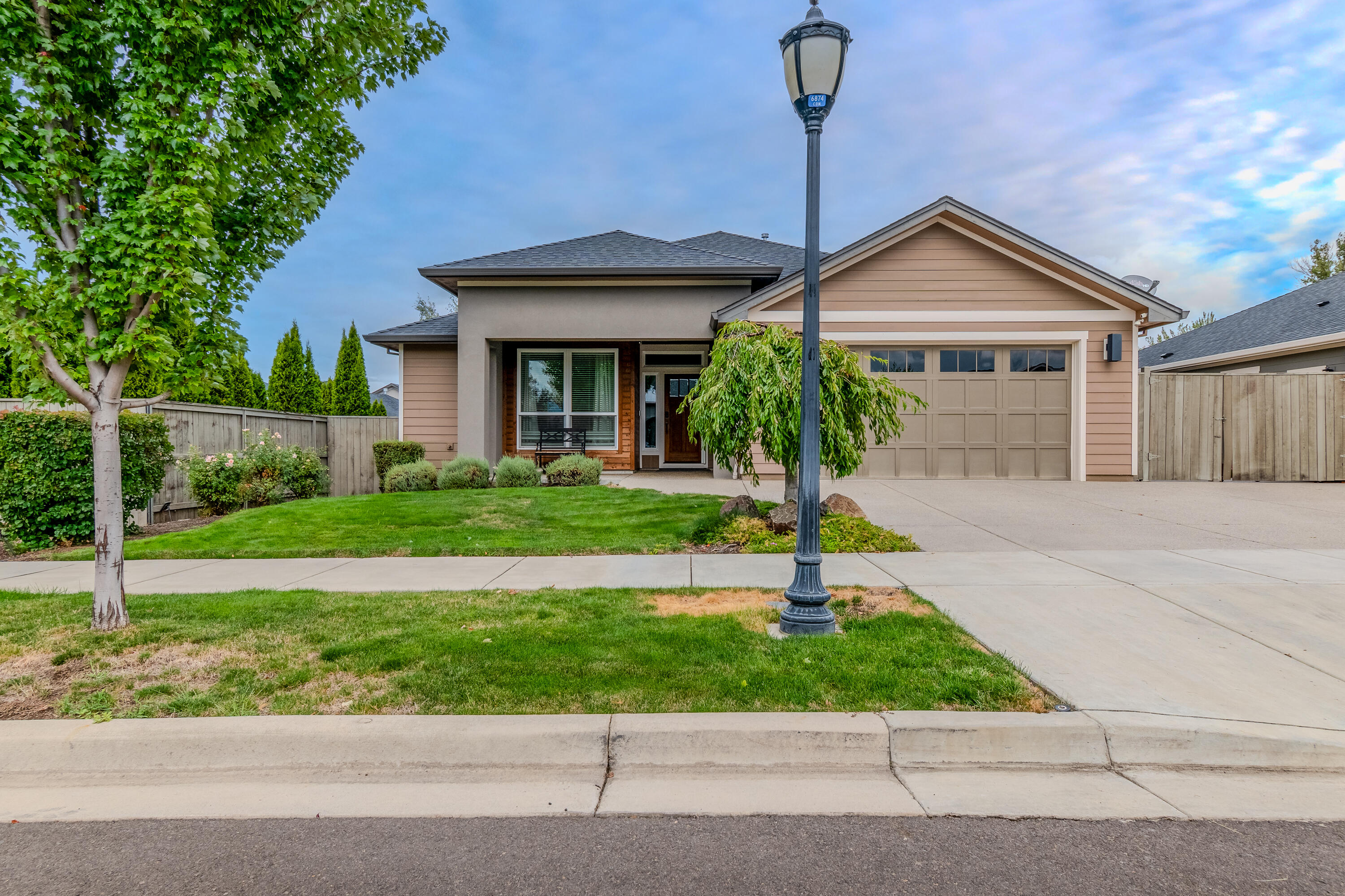 Welcome to this beautifully designed 1,877 sq ft home offering a spacious open-concept layout and high-quality finishes throughout.
This home features custom cabinetry, granite countertops, hardwood and tile flooring, and detailed ceiling treatments. The kitchen includes a large island and walk-in pantry, flowing seamlessly into the living and dining areas.

The primary suite includes double sinks, a walk-in closet, and a well-appointed bathroom. A spacious laundry room with a wash sink provides added convenience. Large double sliding doors open to a covered patio and a landscaped, fully fenced backyard—ideal for outdoor living.

Additional highlights include a 2-car garage and approximately 12 feet of gated RV parking. This home combines comfort, functionality, and thoughtful design in every detail. Agent is Related to the seller.