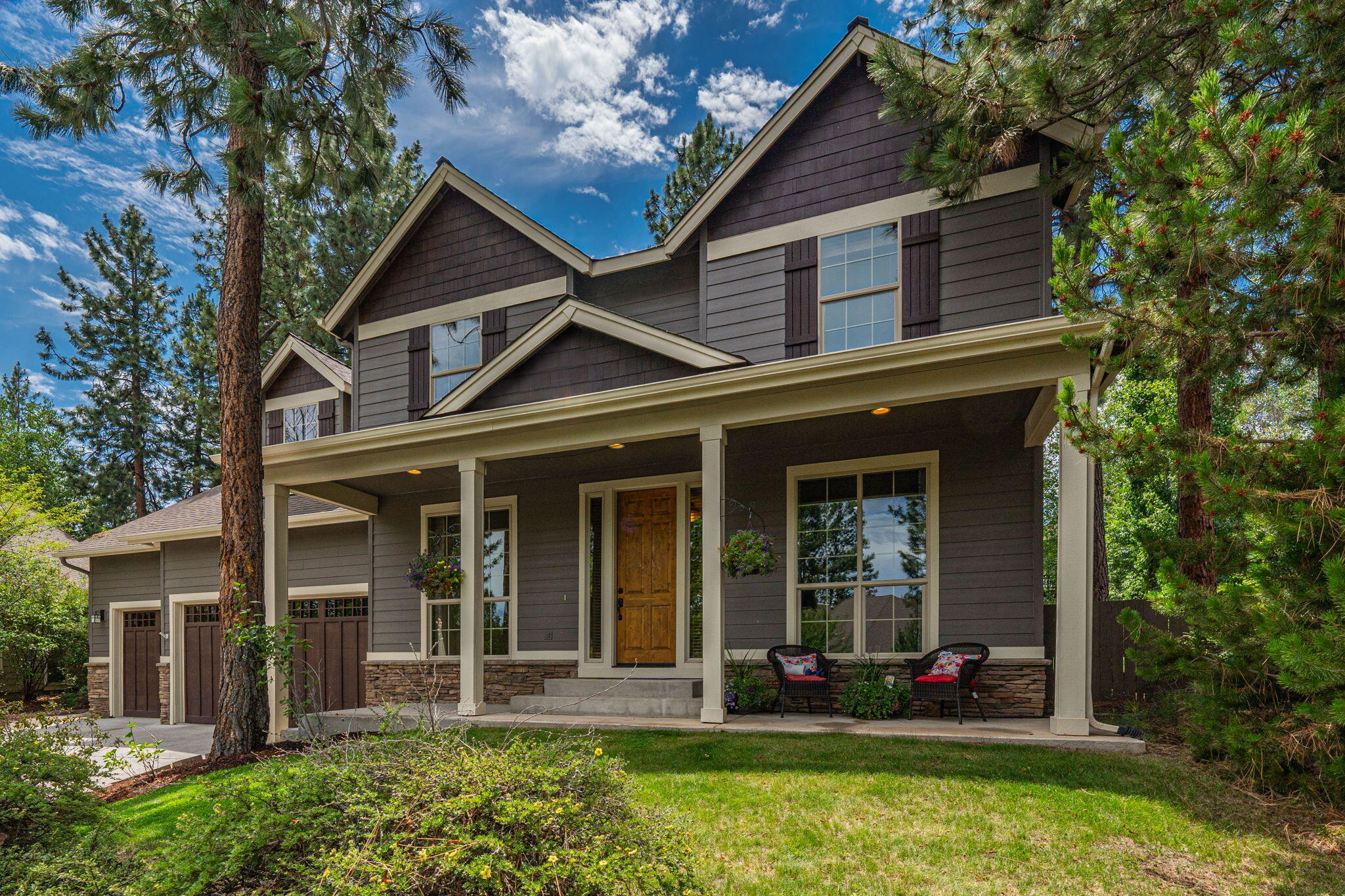 Welcome to your dream home in the River Rim neighborhood. This community is known for its friendly atmosphere, well-maintained streets, and proximity to top-rated schools, shopping, dining, and recreational opportunities. Inside you will find a functional open floor plan with 4 bedrooms, plus an office, plus a bonus room!  The great room is anchored by a floor-to-ceiling rock fireplace, flowing seamlessly into the kitchen with high-end appliances and granite countertops. The main-floor primary bedroom is a serene retreat with an ensuite featuring a soaking tub and walk-in shower. The exceptional outdoor area includes a putting green, hot tub, entertaining space, and a play structure-this yard is perfect for gatherings. Located in a sought-after neighborhood with top-rated amenities, this home blends style, comfort, and functionality. Schedule a private tour today and experience this amazing home in River Rim.