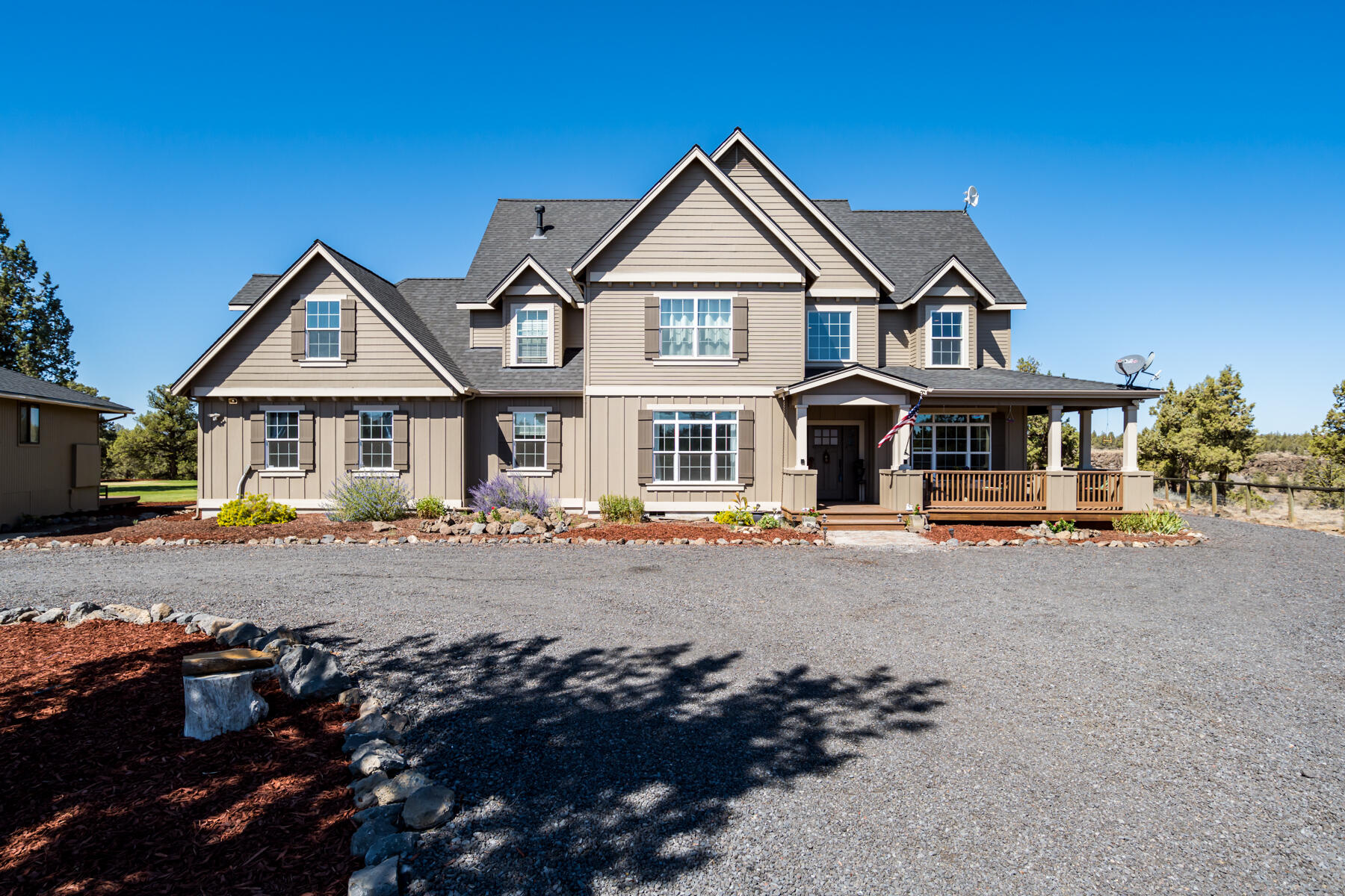 This unique & private 5 acre property on a cul-de-sac is truly amazing! From the moment you enter through the private gates to the beautiful Cascade Mountain views over the hidden canyon! This property offers everything that you would ever want! Some of the features include beautiful hickory hardwood floors, granite counter tops, stainless steel Jenn Air appliances, two primaries (one on main), fire sprinkler system, speaker & security system, tankless water heater, new roof 2020, new ext paint 2015. Mother in law quarters with bedroom, family room, kitchenette & separate entrance. Gorgeous rock hearth surrounding fireplace in the living room, office downstairs & huge bonus room upstairs. The heated almost 3000 sq ft shop/garage has a bathroom downstairs & upstairs you will find the finished loft, which is ready to make your own! Lots of parking for your RV, toys, or extra vehicles. The possibilities are endless! So much storage! Check out the virtual walk through matterport!