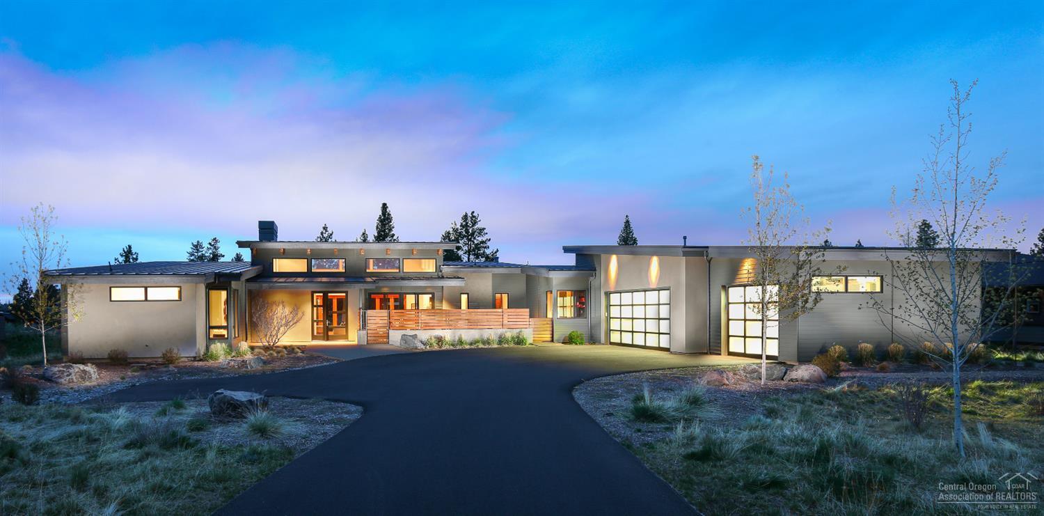 Quality and sophistication await you in this exceptional single level home in the sought-after Tetherow community. The progressive architecture and contemporary design of this Bend Trend-built home will not disappoint from its stunning accordion style wall of windows to its gourmet kitchen with Wolf range and double ovens, custom paneled Subzero refrigerator and wine fridge, and quartz counters. An entertainer's delight with outdoor built-in BBQ, heaters, Jacuzzi, and both golf and mountain views.