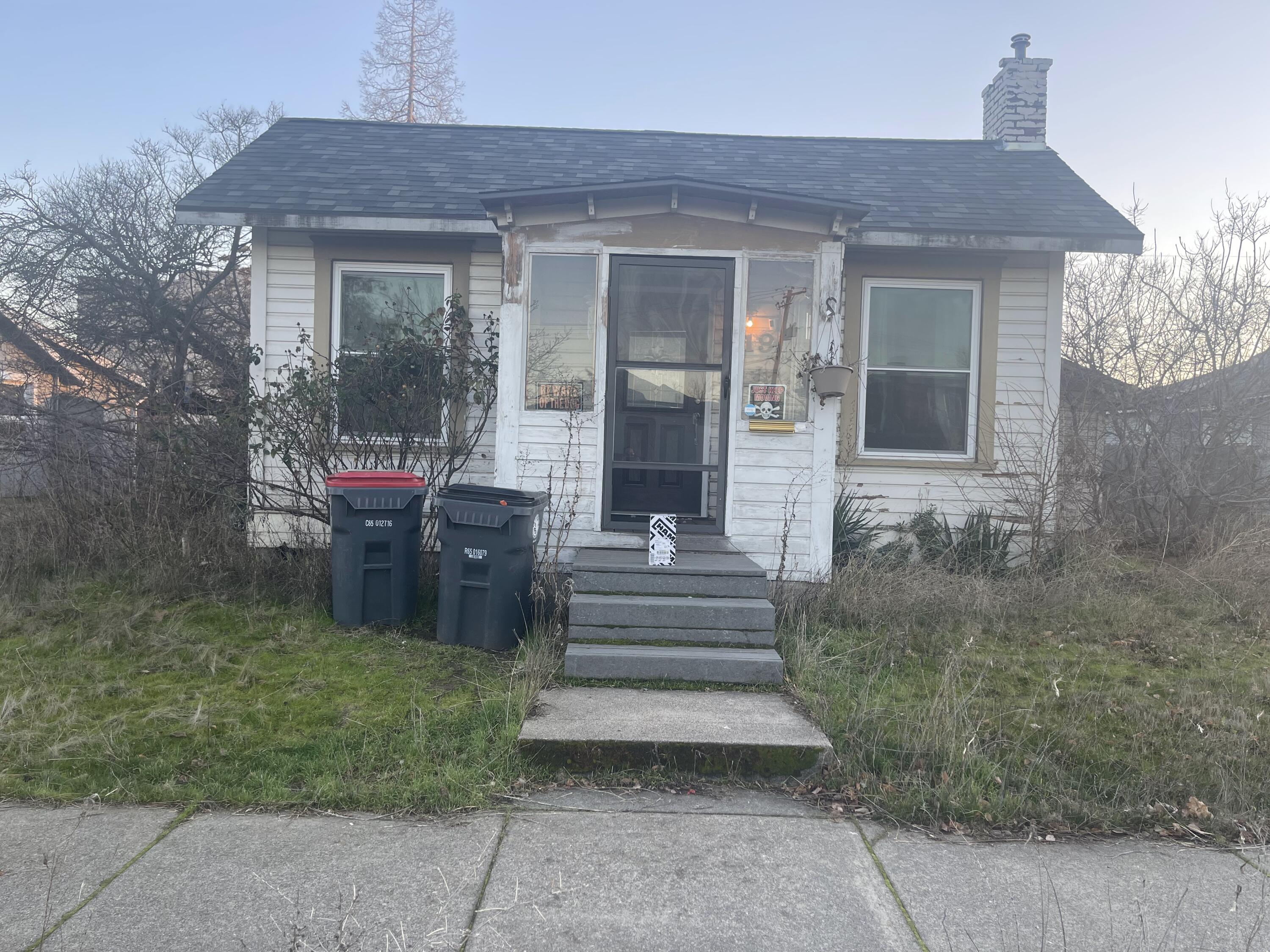 This progressive era home consists of a large living room, galley kitchen, dining area, laundry room, one true primary bedroom and an office/spare room. With the right care and restoration, it can be a great starter home or rental. Large lot with alley access. New roof in 2019 Possibility of ADU or additional unit, per City of Medford the lot could hold an additional two units if the space works for it buyer to do own due diligence.