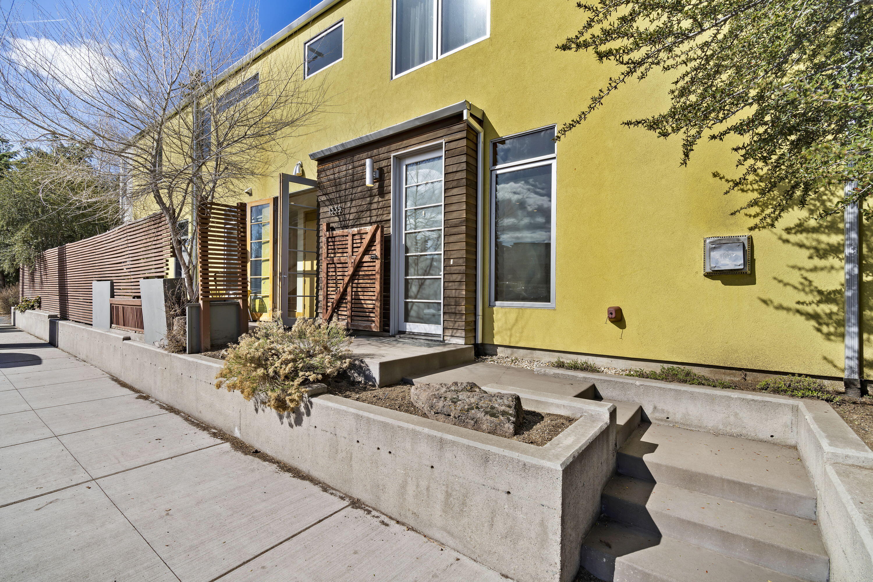 Enjoy this Fully Furnished Short Term Rental with a Legacy Permit in the heart of Bend's Westside! This 3 bedroom, 2 1/2 bath home features radiant heated concrete floors, solid wood doors, gas appliances & newly tiled fireplace. You will find the Kitchen & Living spaces have plenty of room for entertaining. The second floor Spacious Primary Bedroom has a private patio and a very generously sized bathroom including a soaking tub with subway tiles in the bathroom. The side yard features a lovely patio setting with a BBQ area and extra seating which is a perfect for year round use. This home has a high walkability score and is moments from shopping, restaurants, parks and bike trails right outside your front door. The home has a long record of rental income! This would be an easy transition for any new investor to take over this amazing property. Call today for a private tour today!