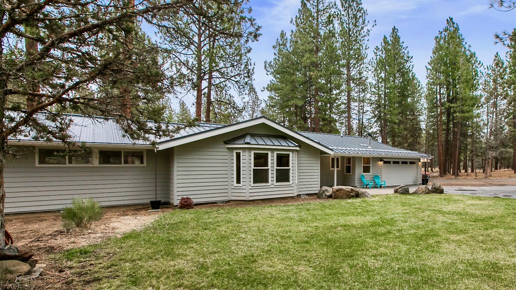 Saddleback West at the edge of town with easy access to Shevlin Park and Bend city limits. Extensive down-to-the-studs remodel single level with new custom metal roof. Gorgeous new kitchen with SS appliances, gas range, slab quartz counters, farm sink with rustic alder cabinets. Great room with gas fireplace, wall of windows with view of backyard park setting. Two primary en-suites both with backyard access. Radiant zone heat in the primary suite, all 3 bathrooms and mudroom. Room to roam in the backyard with park like setting, deep ring fire pit, deck and patio. This home won't last long. It feels like new construction inside, including new wiring, plumbing, insulation, sheet rock, luxury vinyl plank floors, new doors and closet doors throughout home. New styles for the heart of the home.