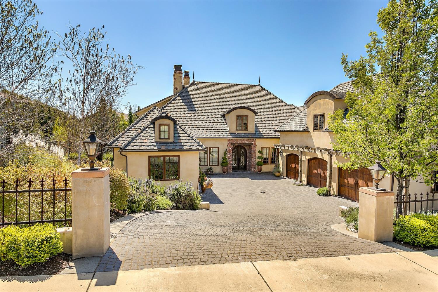 Where Excellence Lives in Saddle Ridge Subdivision! Old world country design w/exquisite details inside & out! Cobblestone entrance. Reclaimed wide-plank flooring from San Francisco. Reclaimed wood beams from Nova Scotia. Reclaimed brick. Imported Byzantine flooring & top-of-the-line wool carpeting. Interior plaster walls & ceilings. Handmade chandeliers. Kitchen offers Subzero professional refrigerator, dual zoned wine refrigerator, imported French Range/Oven w/6 burners & simmer plate, pot filler, microwave drawer, dishwasher, wood burning pizza oven, pantry closets & butler's pantry w/dishwasher. 4 master suites. Main level master w/fireplace & spacious dressing room. Office on main level. Large upper level bonus room. Inground pool w/adjacent hot tub. Outdoor fireplace. Custom carriage doors on 3 car garage. Imported concrete tile roof w/copper barrel details, copper gutters, cupola & finials. 4 HVAC systems & hot water heater w/recirculating pump. Engineered foundation.