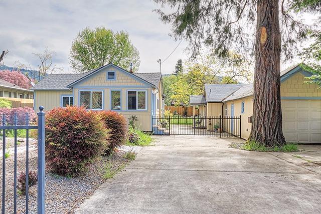 This sweet and cozy cottage is ideally located on NW Washington with easy access to the town library, Growers Market and the First Friday Art Walks. Avail yourself of these small town offerings, then come home to enjoy the large fenced back yard. The original garage, converted to a photo studio, makes a great ADU for a 2 family set up for those with tiny house'' desires. Unit 1 is 784 sf. Unit 2 is 488 sf.