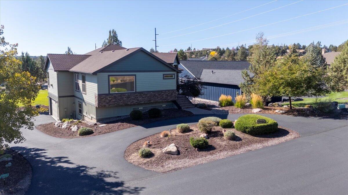 Nestled in the desirable Eagle Crest Resort community, 1940 Murrelet Dr offers luxury living with 3,421 sq ft of thoughtfully designed space, featuring 5 bedrooms, 3.5 baths, vaulted ceilings, a grand great room with a gas fireplace, and a gourmet kitchen with double ovens, cooktop, breakfast bar, and custom finishes. This 2008 custom-built home includes two primary-suite options, a fully finished lower level with exterior access perfect for guests or recreation, and a private outdoor living area with a patio and hot tub overlooking golf-course and mountain views. A 3-car garage plus RV parking accommodates all Central Oregon lifestyle needs, while low-maintenance landscaping with drip irrigation enhances year-round enjoyment. Located within Eagle Crest Resort, residents enjoy access to golf, pools, fitness centers, sport courts, trails, and dining, all just minutes from Redmond. A rare blend of comfort, quality, and resort amenities—this home exemplifies premier Eagle Crest living.