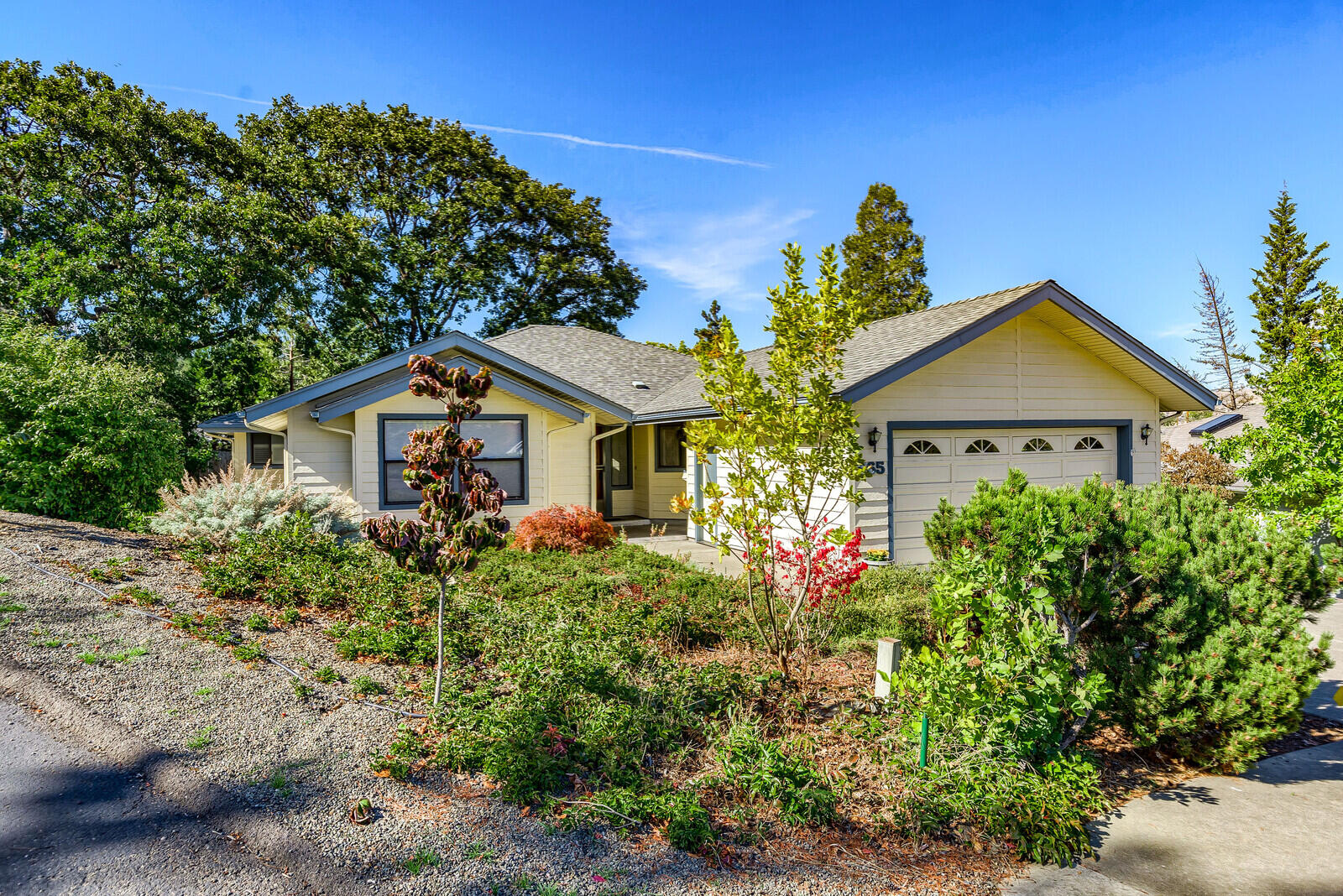 Immaculate single level Ashland home located on a cul-de-sac near Oak Knoll Golf Course. Spacious open floor plan with vaulted ceiling, wood burning fireplace with a blower, upgraded granite & Corian countertops, stylish tiled master shower, skylight, ceiling fans, breakfast nook & island in the kitchen, a wonderful screened in deck to relax on & an attached 2 car garage. The front bedroom would make a great office or den with built-in wall shelving, etc. All appliances included. The roof is only 10 years old & the forced air furnace was replaced in 2016. Enjoy easy care living with a low maintenance yard. There is an automatic sprinkler system & a storage shed for your garden tools/supplies. Truly a quality home ready for you to move right in!