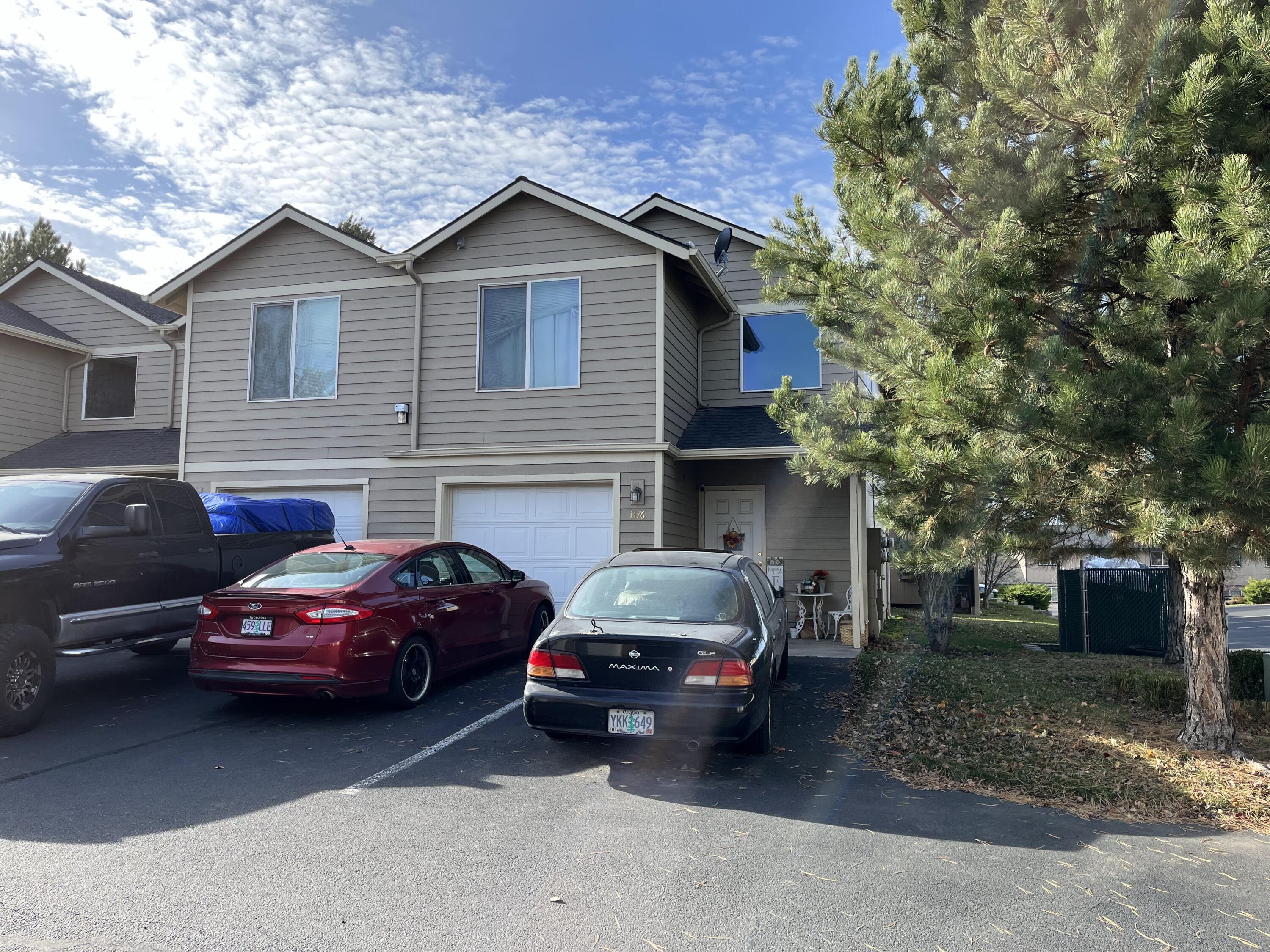 Attn Investors or first time home buyers!! Great value for this 2 bedroom plus office, two story condo unit with single car attached garage.  Corner unit. Main level features kitchen, dining, living room, and half bath.  Bedrooms and office are upstairs.  Spacious master with large walk in closet and 5 ft shower. Laundry closet is conveniently located upstairs with the bedrooms.  The home is in need of carpet replacement and fresh interior paint.  HOA includes sewer, water, garbage, snow removal, and exterior maintenance.  Location  in SW Redmond makes it easy to get around Central Oregon.  City park across the street from the complex!