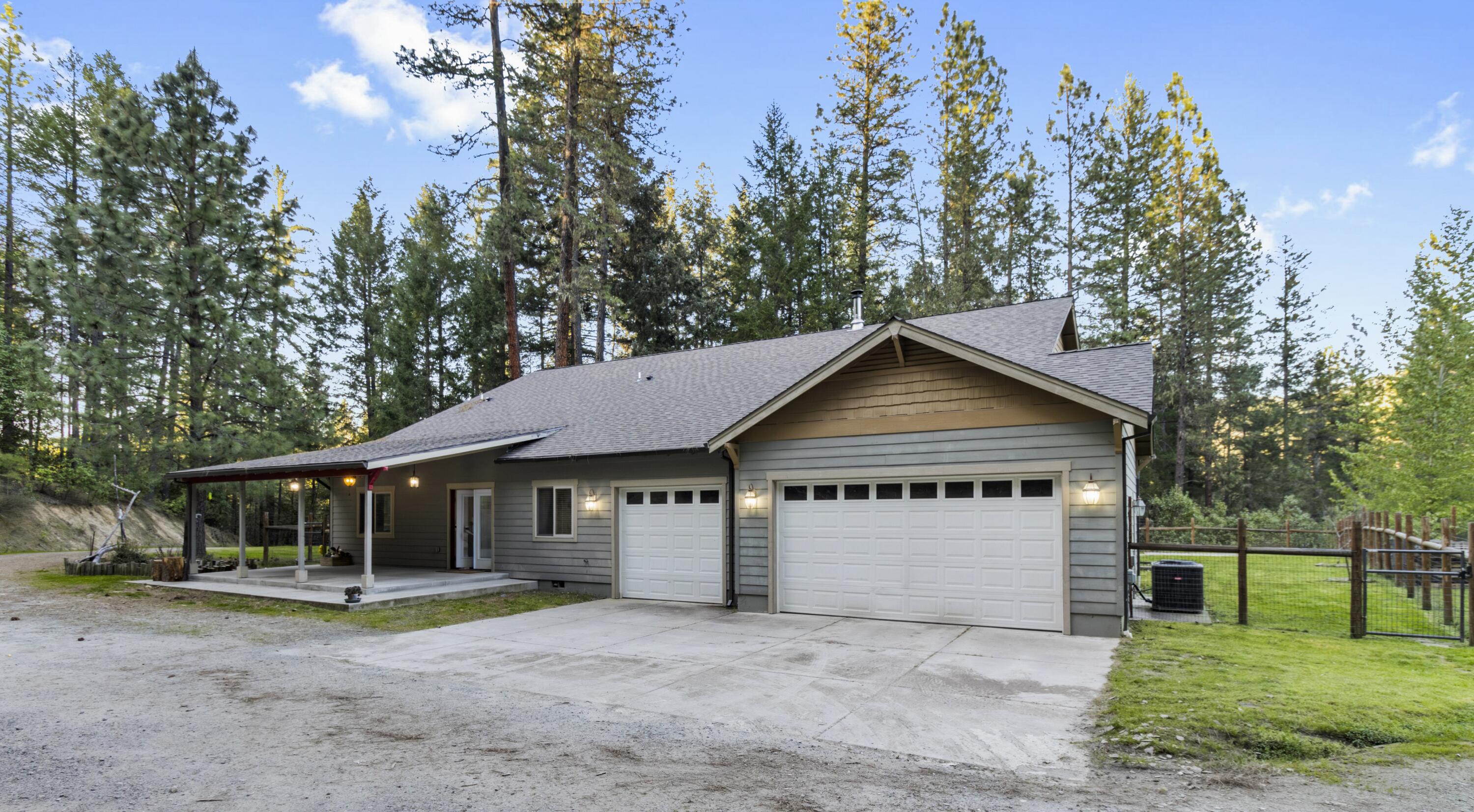 This custom ranch-style home features 4 bedrooms, 2 baths, ~2,753 sq ft of living space, and sits on ~9.16 wooded acres. Highlights include vaulted ceilings, skylights, custom cabinetry with granite countertops, double ovens, a cozy wood stove, a finished 3-car garage, fenced backyard and garden, and RV parking. This is a short sale — the lender already has the appraisal in hand, which may help streamline approval. Home offered as-is. All terms subject to lender approval. Showings by appointment.
