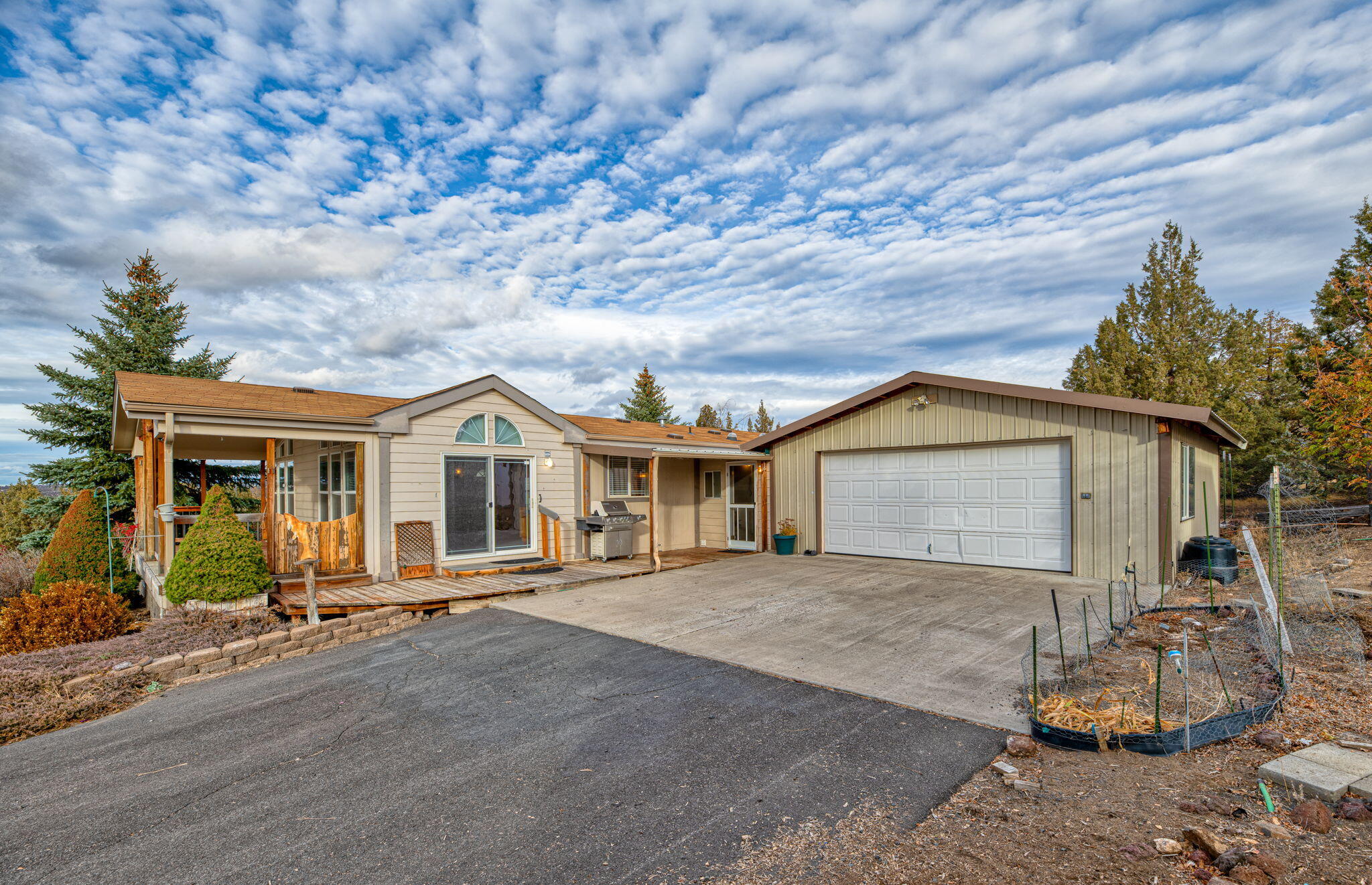SPORTMAN'S PARADISE, MOUNTAIN VIEW RETREAT W/ EXCEPTIONAL SHOP SPACE & PRIVACY! 1.86 acres! Experience the perfect blend of comfort, adventure & functionality in this beautifully maintained property w/ mountain views & backing up to 400 ac. of BLM land. 40X40 dream shop, w/ 3 roll up doors- one tall enough for RV. Shop has 16' eaves, high-bay lighting, windows for visibility & 220V power. Private well. Home offers peaceful living w/ room to work & play! High vaulted ceilings, beautiful tall windows filling the room w/ natural light & overlooking the scenic landscape! 3 beds, 2 full baths incl. relaxing soaking-tub suite. Bright kitchen w/ abundant storage space. Covered deck w/ sweeping views of the Cascades & quiet High-desert surroundings. 2 car garage, paved driveway, Connex storage container & garden space. 8X12 shed & heated pump house for storage! Near Prineville Reservoir, & 12 mi. to Meadow lakes GC. See docs for more info.