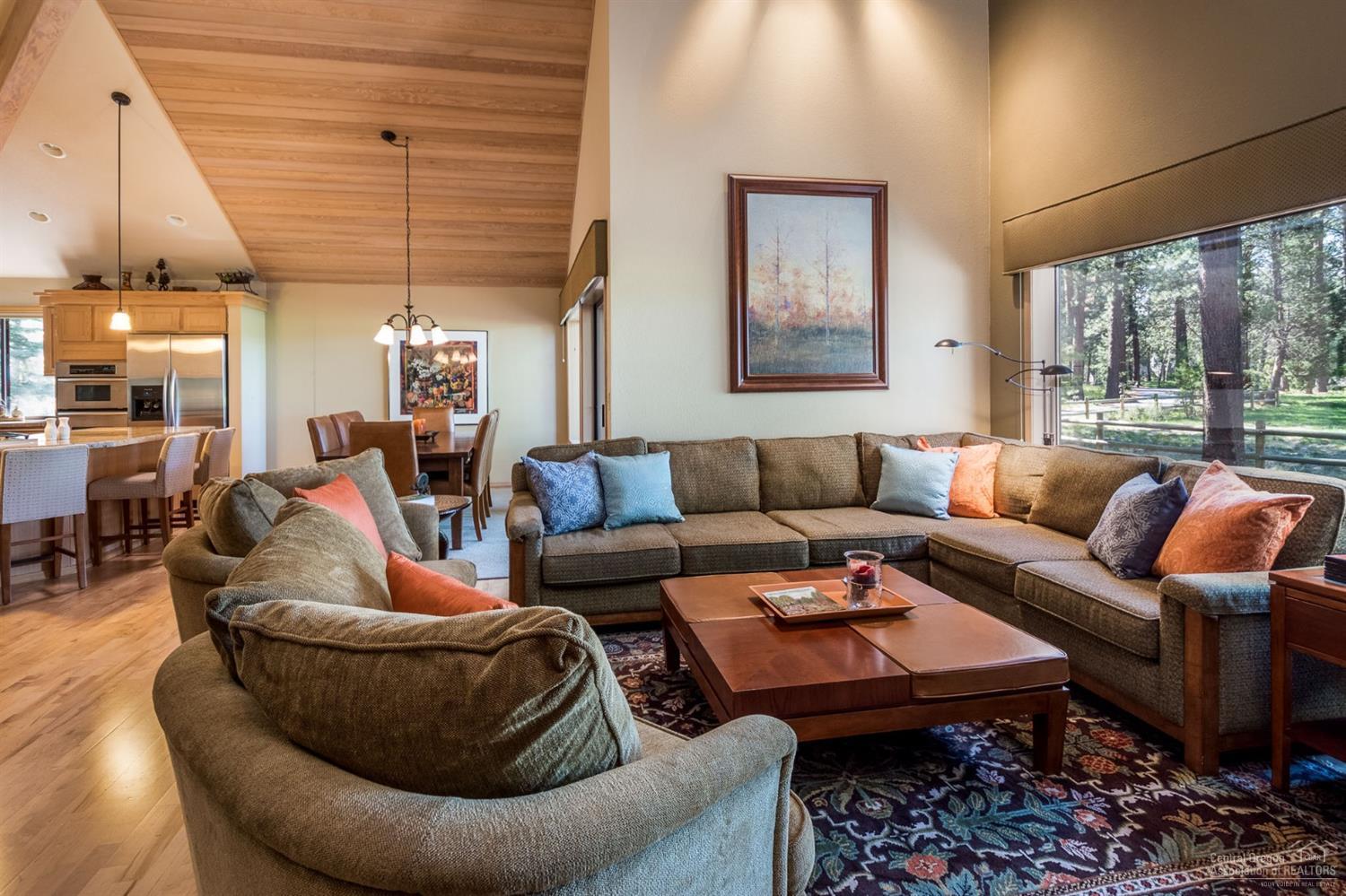 ONE of a kind location! Panoramic View of the 14th Green of Sunriver Resort Meadow Golf Course. Enter the home and enjoy a wall of windows with an endless view of the golf course. Floor to ceiling Ochoco Stone gas fireplace. Open great room with large kitchen and storage galore. Upgraded features include: granite counters in the kitchen and bathrooms, Kitchen Aide appliances, extra quiet Bosch dishwasher, 5 burner gas stove top, pullout cabinets in the kitchen, hardwood floors, carpet, gas furnace & hot water heater. Guest bathroom features tile heated floors undermount lighting & custom tile in the tub/shower combo. Master on the main level with 2 additional bedrooms upstairs. This home features lots of storage and central vac. SHARC paid. The hot tub location is grandfathered in. This location offers easy access to the SHARC, Village, Resort, River and Marina. Don't miss this one! It is a true Sunriver GEM and won't last long!