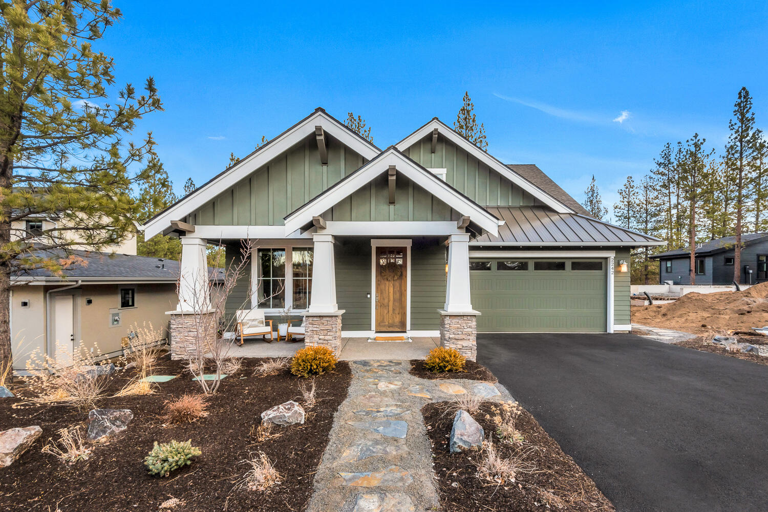 Offered for sale is this beautiful, almost new and lightly lived in craftsman style home with a separate ADU in Outcrop, one of Bend's newest westside neighborhoods. The terrific open floor plan has an abundance of natural light and a great room with exposed beams that flows into the kitchen creating a lovely space for gathering. Fantastic kitchen with large island, slab quartz countertops, stainless steel appliances and an ample pantry. The main floor also includes a spacious primary suite and a private office. Two more bedrooms, full bath and a comfy bonus room upstairs. The fully fenced and landscaped backyard has a brand new very useful 1bd/1ba 528sf ADU, a wood burning fire pit sitting area and a covered deck with recessed lighting accessed right off the kitchen perfect for those summer BBQs and outdoor entertaining. All this in a wonderful COBA award winning builder community next to Northwest Crossing just a few blocks from parks, restaurants, shops, schools and trails!