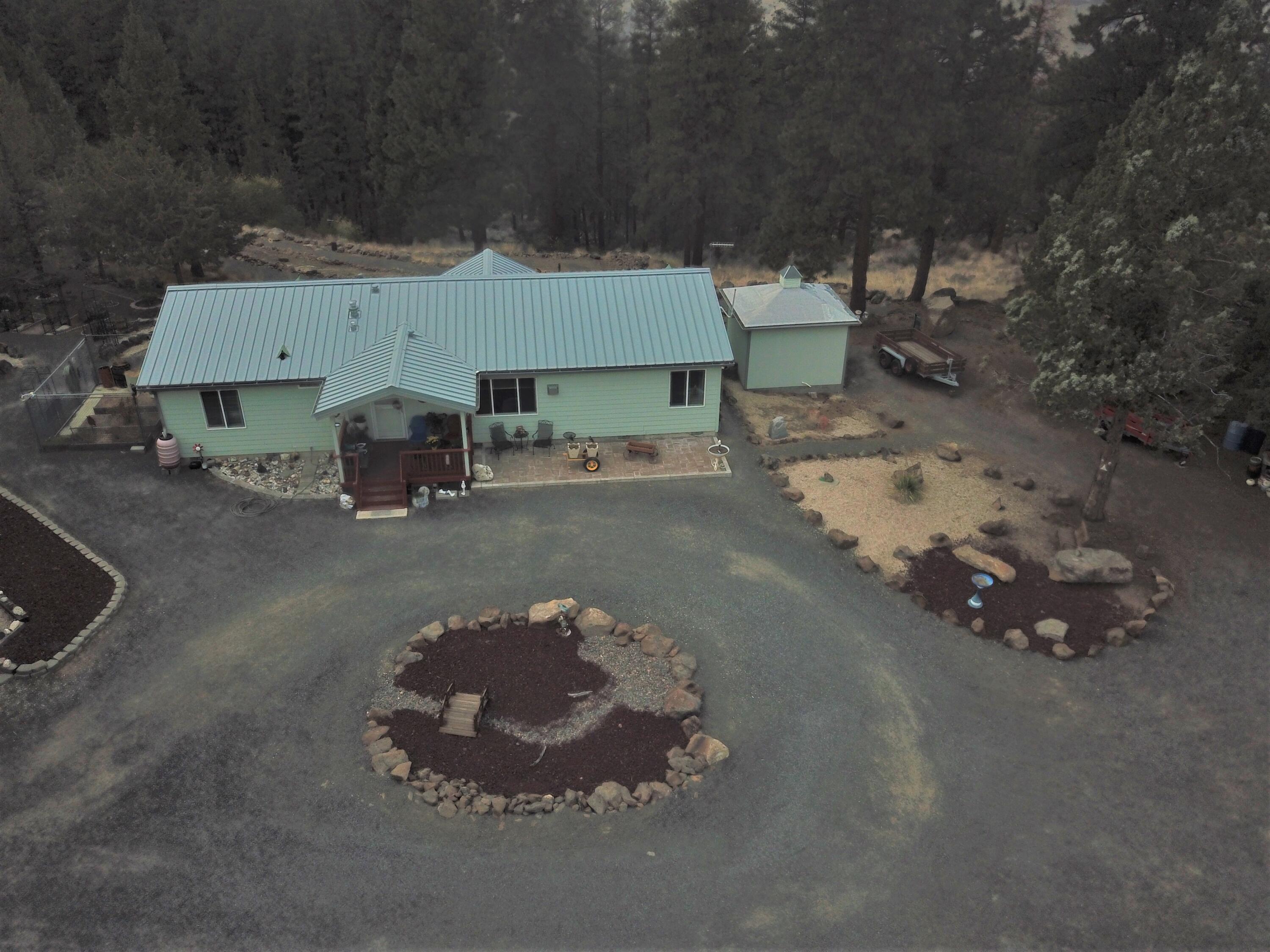 Tranquil location with expansive views of Green Ridge and Mt. Jefferson. The 3/2 manu sits on 5+ acres and is move-in-ready for full-time or vaca use. Detached, oversized double garage plus a 1440 SF shop for storing toys or as work space. The ''back yard'' is meticulously landscaped with walking paths leading down the West facing side with all natural surroundings.
This property is located 200 yards from the registered airstrip OG00 and is the only road allowed to taxi to the end of the runway. Pilots take note! Solar, rain capturing, Eco-friednly and views to take your breath away. A must see.