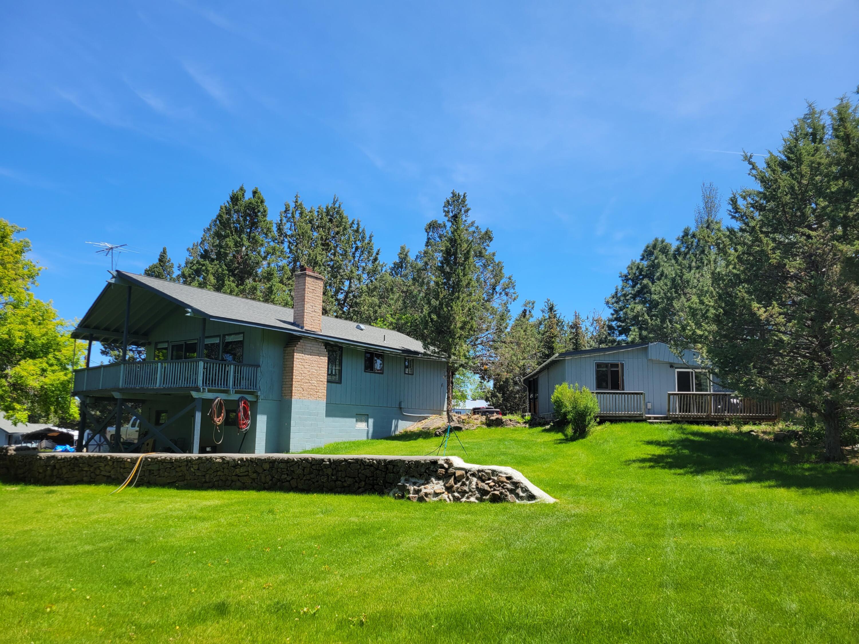 Available for the first time in over 35 years! Beautiful, close-in 1.8 acre setting with Avion Water Service, 1 acre of Swalley Irrigation water rights, irrigation pond, flowering trees, horse corral with loafing shed, and detached garage with workshop. Prime location between Downtown Bend and Tumalo near the Deschutes River, Riley Ranch Nature Reserve, Tumalo State Park, and Cascade Village Shopping Center . Avion Water serves the home and a well on the property is registered with the state of Oregon but is currently not in use. In addition to the main home, there is a 576sf ''Vacation Cabin Class 4'' - per the assessor's office (DIAL) -  - not included in the SF shown. Gorgeous wood-lined ceiling in Living Room. Newer roof and irrigation pump motor. Estate sale - offered ''as is'' and waiting for a new owner to make it their own! Legal Lot of Record has been established and verified by Deschutes County.