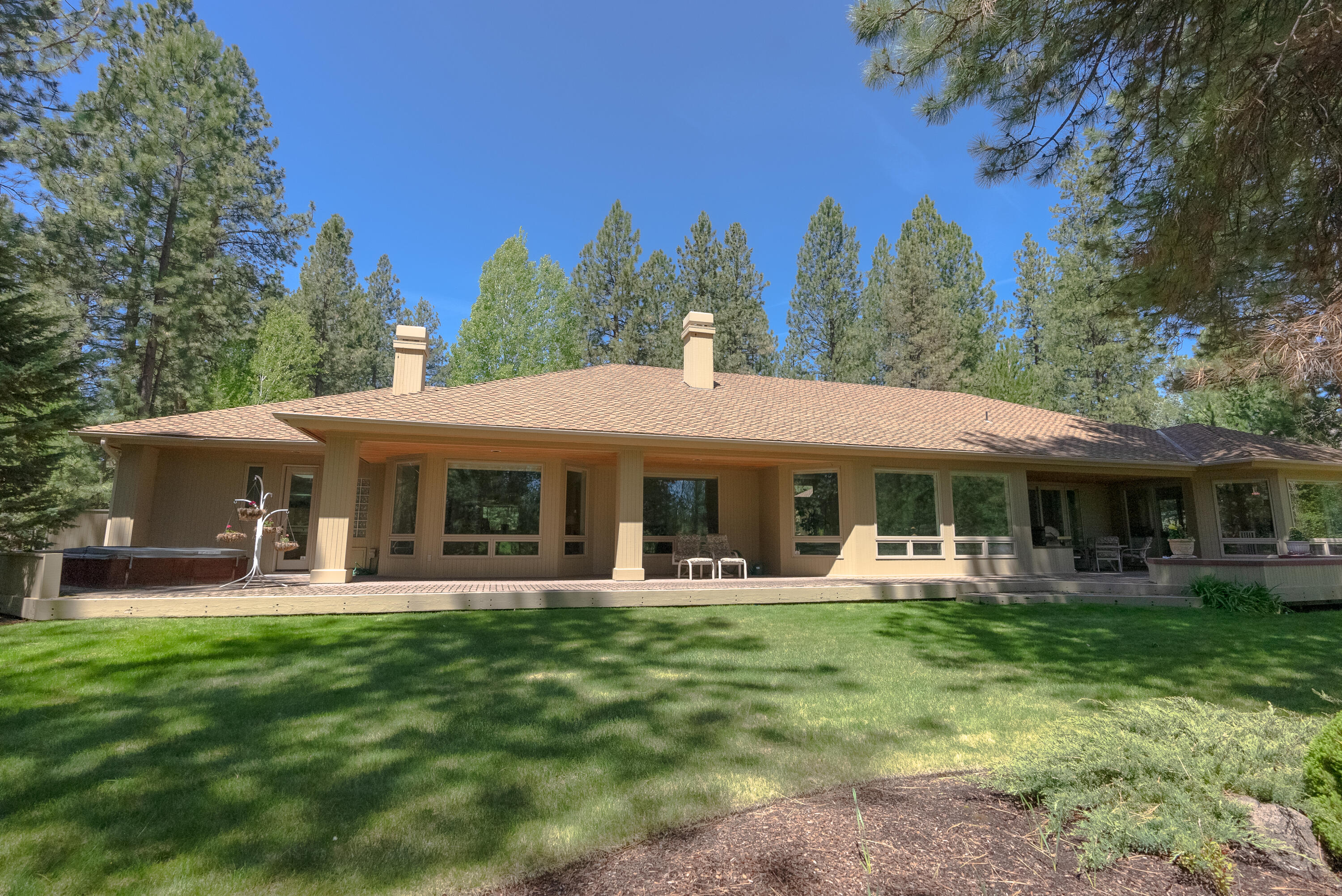 Imagine entertaining on this nicely covered deck with a peaceful setting on the southeast corner of Widgi Creek overlooking the 12th green & fairway with lots of Ponderosa Pines. This single story home sits on semi private golf course with three bedroom suites all on the main floor with a 4 car/cart garage. A huge great room with towering vaulted ceilings, wet bar overlooking the golf course with the back drop of the forest. Custom raised panel cabinetry through home in kitchen, dining room, great room, sunken wet bar, bedrooms, bathrooms, utility & mud room. Expansive 850 sf plus paver deck with hot tub off master bedroom or bathroom. Master bathroom complete with dance studio ballet barre and wall mirror with tile & indoor/outdoor carpet. This home has special lighting under & above cabinets, dimmers throughout home & lots of carefully thought-out special features. Golf & indoor pickleball memberships available.