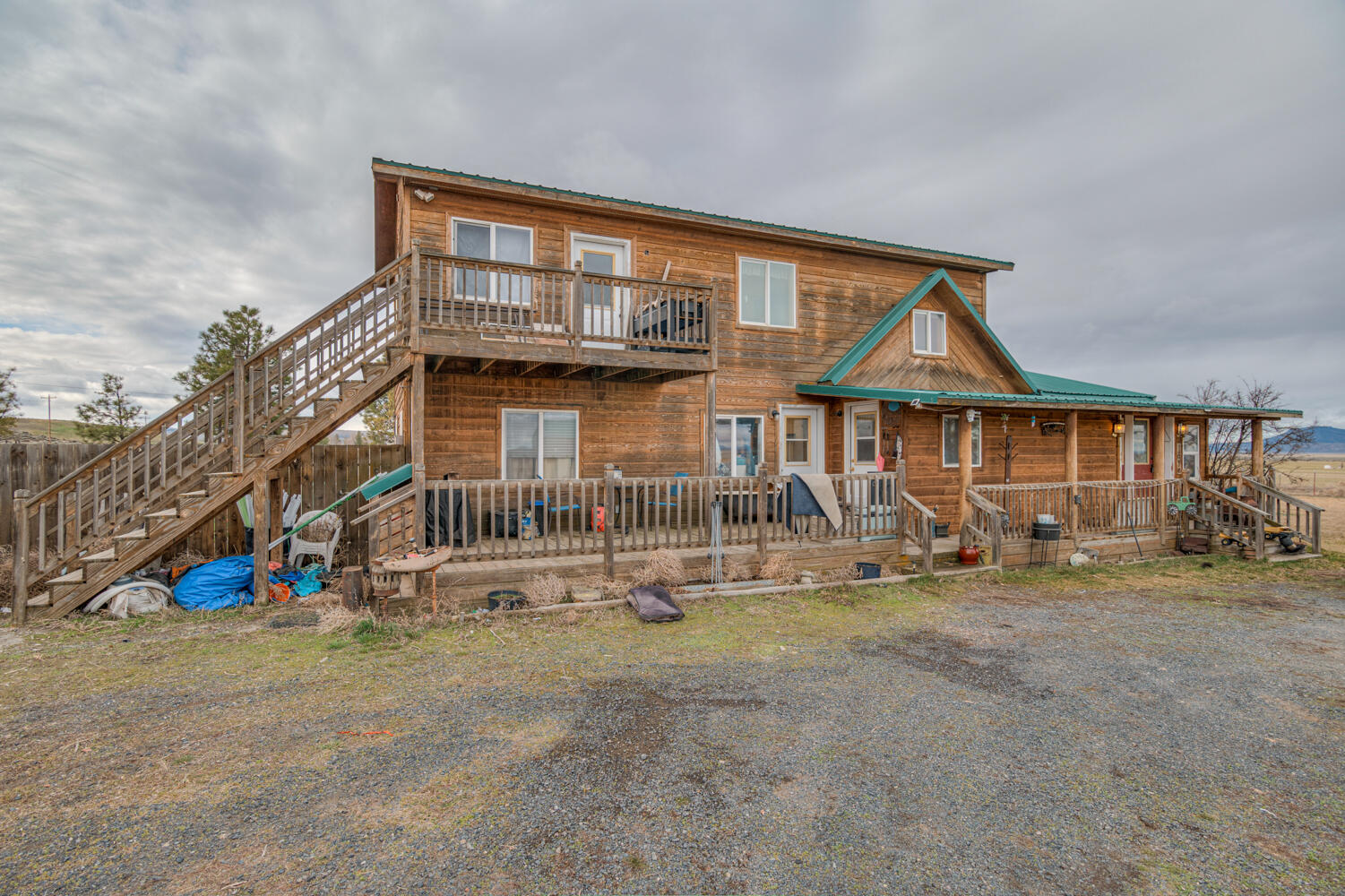 Escape to the serene setting of this charming cabin-style home nestled on one acre of picturesque land. This rustic yet modern 4-bedroom abode offers a perfect blend of tranquility and comfort, featuring all the amenities you need to unwind and enjoy the beauty of nature. As you step inside, you'll be greeted by the warmth of wood-clad ceilings and a cozy atmosphere perfect for chilly winter nights. The spacious living area is ideal for gatherings with family and friends, complete with ample natural light streaming through large windows that frame views of the surrounding landscape. The heart of the home lies in the well-appointed kitchen, boasting a central island that's perfect for meal preparation and entertaining.

This property offers even more potential with a 1 acre adjoining buildable lot included in the sale. Whether you dream of expanding your retreat, building a guest house, or simply preserving your privacy, the possibilities are endless.