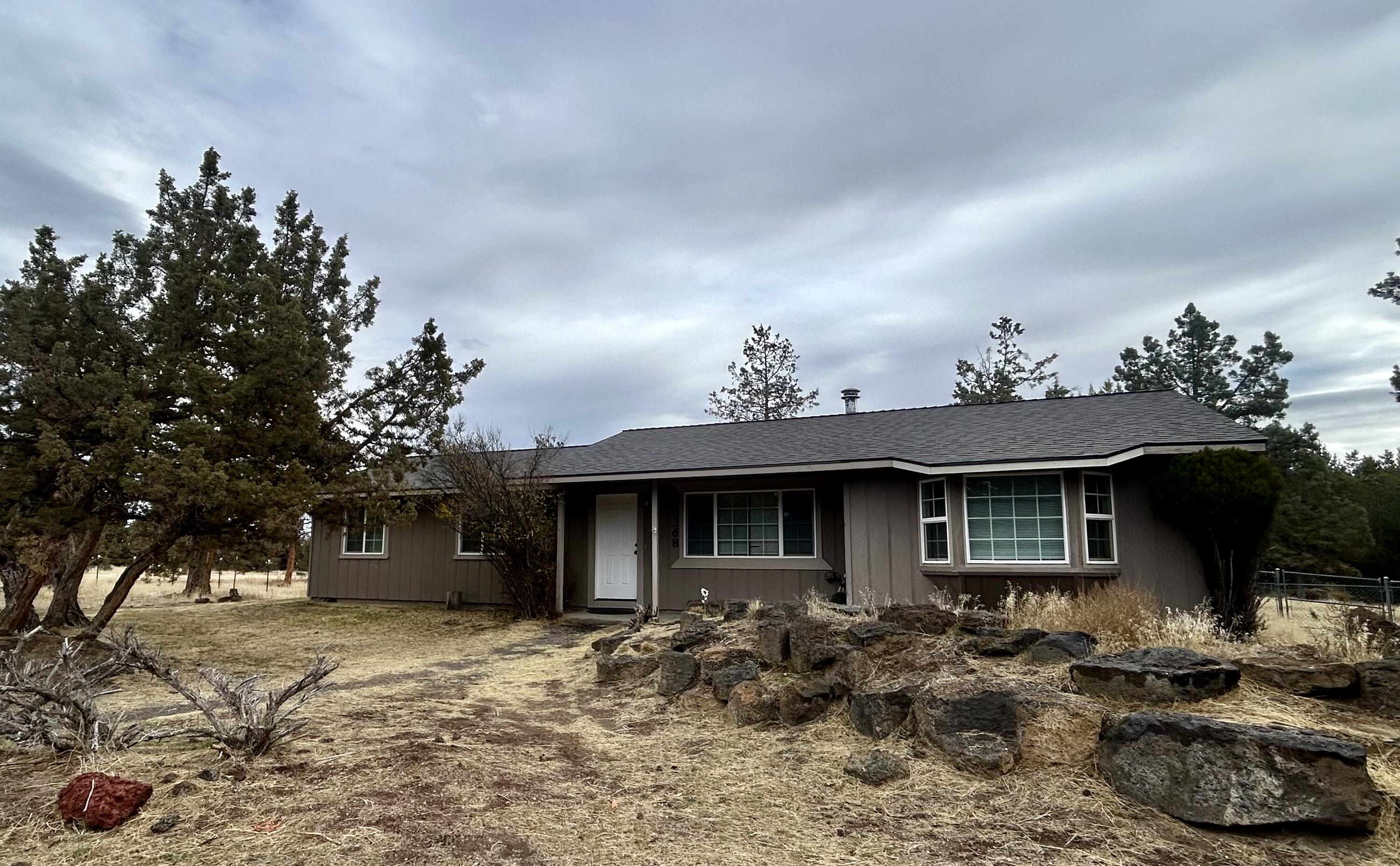Darling home in desirable Cimarron City! Home features New Interior paint, new LVF flooring and new carpets in the bedrooms. New roof in 2022 with septic plus drain field replaced in 2015. 
Tons of storage including shipping container with built in shelves for a future tack room, man cave etc. Two separately fenced areas. One right off the back deck creating a huge back yard for all the fun and another area for livestock, horses, goats, you name it! Large chicken coup and compost area. 
Great corner lot with peekaboo mountain views and multiple BLM access points in the neighborhood.