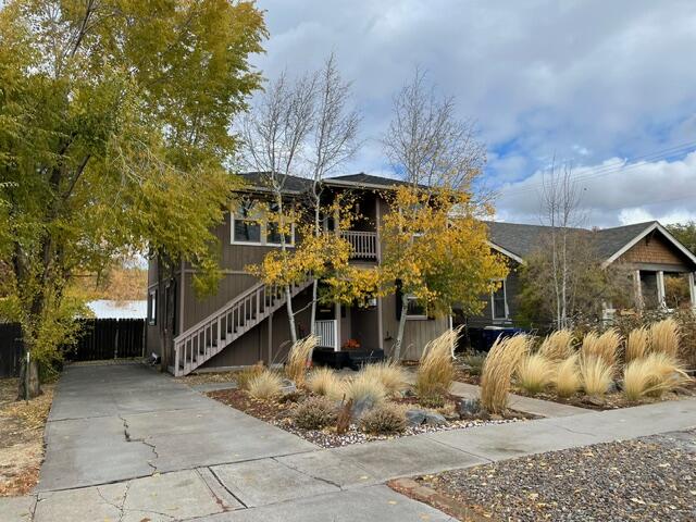 Your Ideal Bend Basecamp-Live, Rent, or Invest in the Heart of It All! Perfectly positioned between Downtown Bend and the Old Mill District, this nicely maintained and updated duplex puts the very best of Bend right outside your door. Enjoy an easy stroll to local shops, restaurants, bars, and groceries—this location is unbeatable for both lifestyle seekers and renters alike. Each light-filled unit offers 2 bedrooms and 1 bathroom, featuring durable concrete floors, an open layout, and ample windows that bring in natural light. The spacious, fully fenced backyard includes raised garden beds and backs to an alley for added convenience. A large storage shed provides plenty of room for bikes, gear, or tools, and the lower unit enjoys its own private, fenced side yard—ideal for pets or extra outdoor living. Off-street parking adds everyday ease, and included plans for an additional duplex on the lot create a rare investment opportunity in one of Bend's most desirable neighborhoods!