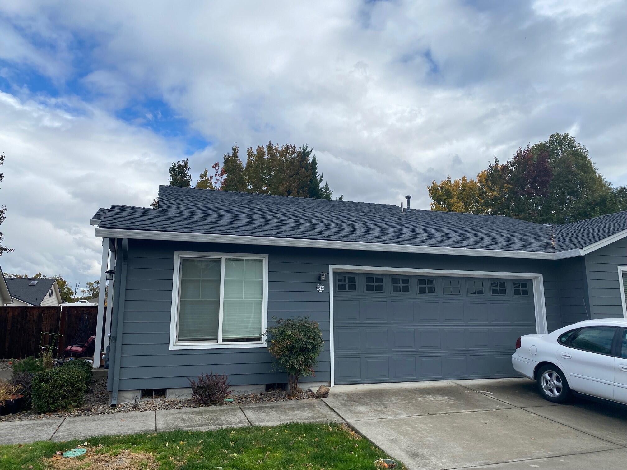 Great opportunity for an investor or first time homebuyer- lovely single level townhome offering a low maintenance lifestyle in a terrific central location. This shared wall 3 bed 2 bath open concept home offers a private fenced side yard w/ partially covered patio area, spacious master suite & fully finished attached 2 car garage. The kitchen is open to the dining room by passthrough/eating bar and has plenty of storage. Vaulted ceilings in the living & dining room w/ lots of natural light from the big transom window above the front door. HOA dues are $107 per month and includes the following: exterior, roof, grounds and sprinkler systems. Tenant occupied, give us a call to schedule a showing before it's gone!