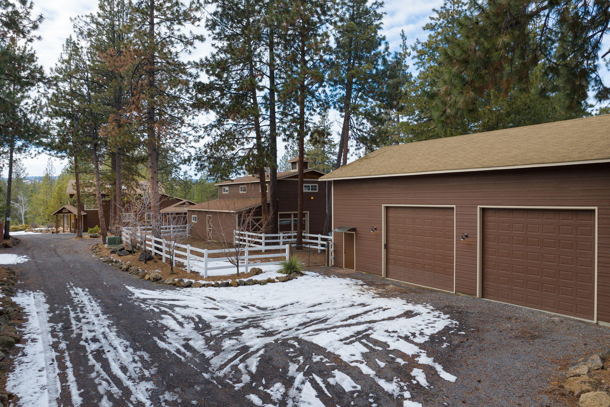With the sound of the river just below & views of Mt Bachelor you're going to need to see this gem! Situated just steps from the Deschutes River this property will definitely impress. The updated home features new flooring & paint throughout, tons of natural light, & new light fixtures. The kitchen includes granite countertops, stainless appliances, opening to a massive new patio and fire pit perfect for entertaining & enjoying the sounds of nature. Upstairs, the spacious master bedroom connects to an oversized master bath featuring a walk in tile shower, soaking tub & sauna. Enjoy the views from the upstairs deck and several other parts of the property. Outside, this home has both a barn and a shop with both being approximately 1500 sq ft. The shop has 2 huge roll up doors & expansive ceilings perfect for anyone looking to store equipment or toys. Both buildings have space upstairs for office or storage.  The barn has multiple stalls plus a tack room. Too many features to list here!
