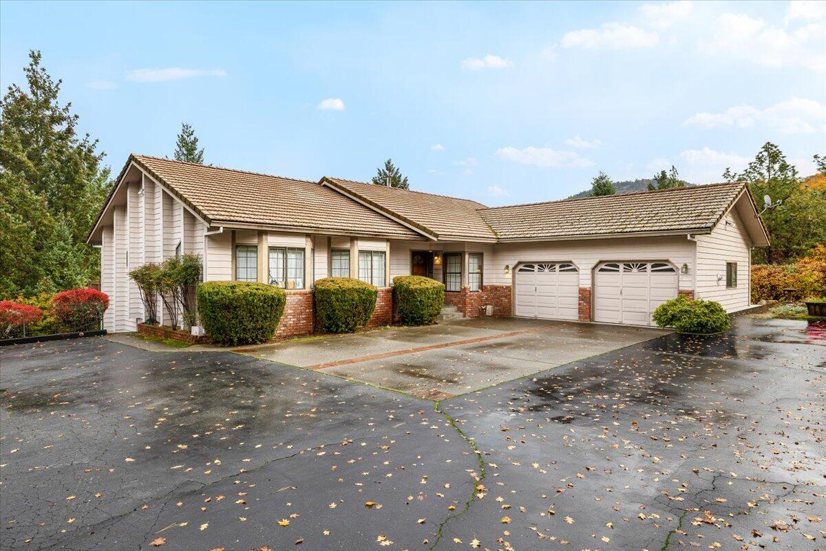 Beautiful Home situated on 2.33 acres for expansive valley and mountain views
Enjoy sweeping views of the mountains and valley from the living room, dining room, primary suite, and the expansive deck of this stunning home. The interior features vinyl plank flooring, vaulted ceilings in the living room, and a U-shaped kitchen with granite countertops and ample cabinetry. The 883 sq. ft. finished basement provides flexible space for a media room, home gym, or additional living area. An oversized two-car garage, covered RV parking with full hookups, and a dedicated storage/workshop area ensure plenty of room for tinkering, tools, and hobbies. Whether you're relaxing on the deck or taking in the scenic views from indoors, this property offers comfort, functionality, privacy and a true connection to its natural surroundings.