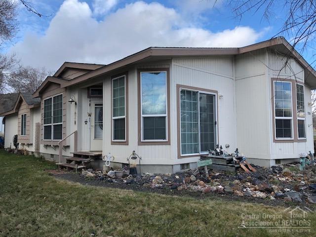 Nice MF Home In Dayville! Located on .39 of an acre gives you plenty of room for country living, 2003 Marlette MF home, 1553 sq ft with covered porch, open floor plan, kitchen features an island, breakfast nook & built in hutch, living room, dining room w/slider leading to beautiful rock garden, utility room, 3 bedroom, master w/2 closets, 2 bath, master with stall shower & garden tub, forced air electric heat, oil monitor stove, composition roof, chain link and privacy fence, irrigated by Cummings Ditch large carport, driveway and street parking. $140,950 #1025