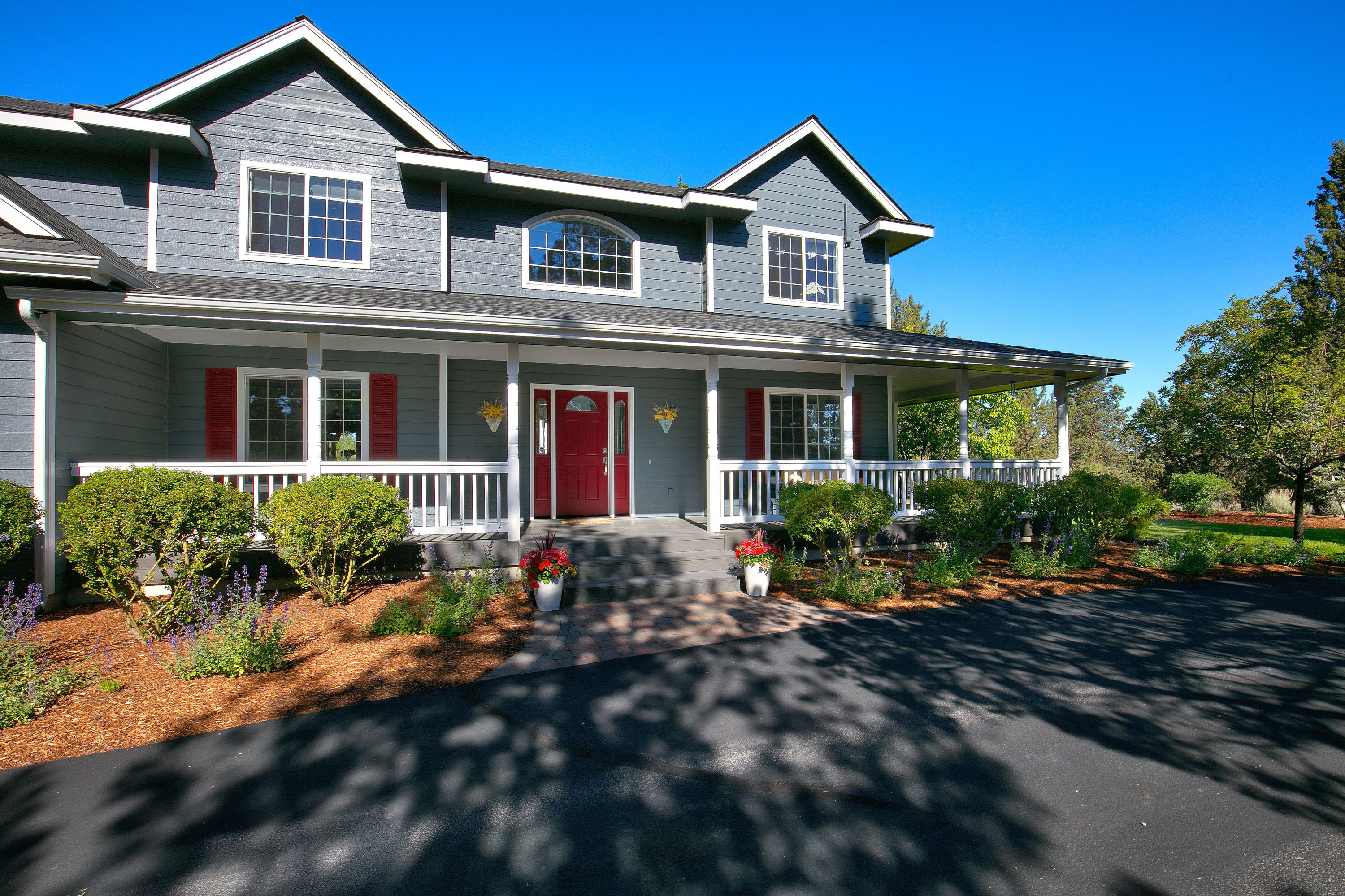 Enjoy country living at its best on this peaceful 9.49 acre property in NW Bend, conveniently located close to Bend schools, amenities & recreation. The home is sited behind the fenced pasture & circular driveway providing privacy & quiet. Inviting front porch is the perfect spot to watch the wildlife while enjoying a cup of coffee in the morning! Stunning Cascade views & sunsets are the focus from expansive rear deck, family room, kitchen & den. Recently remodeled, the light filled kitchen & family room features a large island, quartz counters, new SS appliances & porcelain tile flooring. Dining & living rooms are also on the main. All 4 bedrooms are upstairs, plus 3 bathrooms. Spacious primary suite has a beautifully remodeled bathroom & covered deck, also facing the mountains. Immaculately landscaped with a large rear lawn. A small barn plus the front pasture will provide a home for 2 horses. 10.2kWp Solar system. Attached 2 car garage, ample paved parking, & room to build a shop!