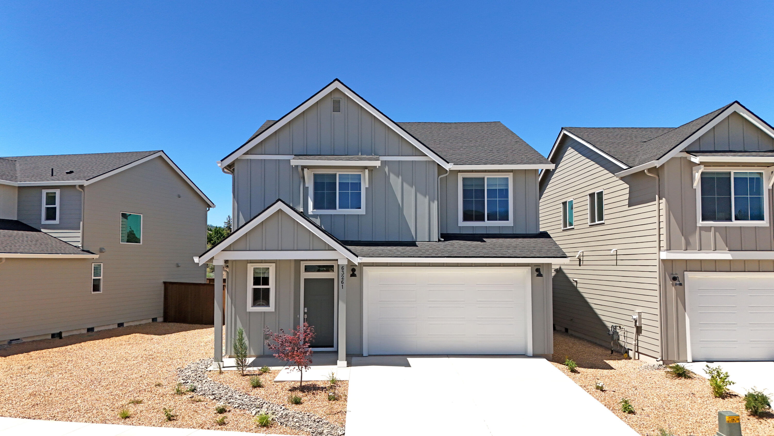 This move-in ready new construction home is in Acadia Pointe, a new NE Bend community with easy access to shopping, dining, and local parks. The Ashland plan is a two-story home with an open-concept first floor boasting a modern kitchen, great room, and dining area, plus a patio and tech nook. Upstairs are four bedrooms, including a primary suite featuring a walk-in closet and en-suite bath with double vanity and separate tub and shower. Two bedrooms share a Jack-and-Jill bathroom. Interior highlights include quartz counters, shaker-style cabinets, LVP in the kitchen & entry, LVT in the baths, and a fireplace. This home also includes central AC, a refrigerator, washer and dryer, backyard fencing, xeriscape front landscaping with drip system, and blinds— at no extra cost! Homesite #63. Rendering is artist conception only. Photos are of a similar home, features and finishes will vary. Taxes not yet assessed. *Below-market rate incentives available when financing with preferred lender.*