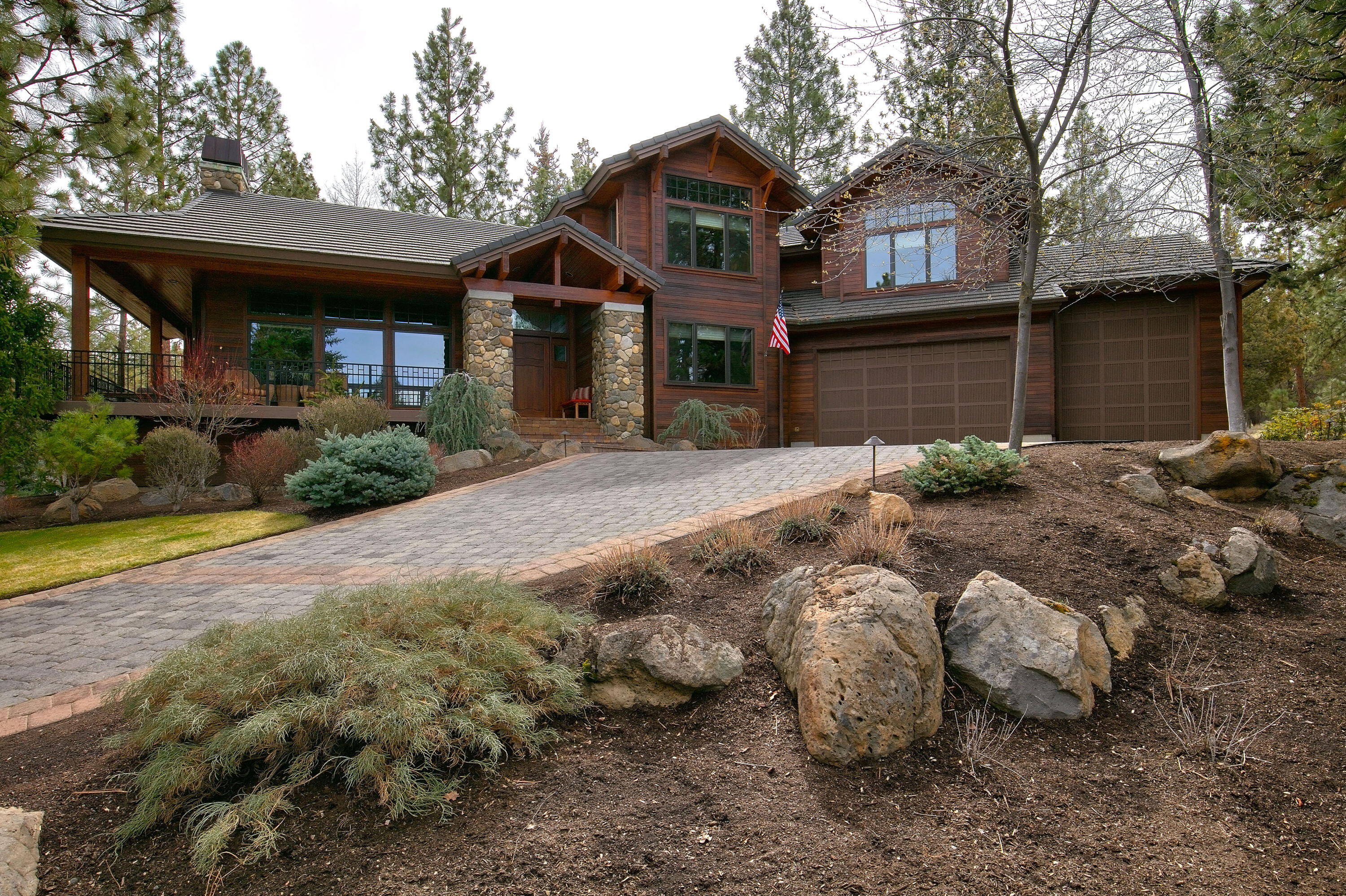 Classic extraordinary custom Norman home in gated/private Awbrey Glen on large acreage.  From the Brazilian Cherry floors and meticulous wood work, with spacious 3 ensuite BR, MBR with radiant heated floors... home offers many amenities.   There is a 4th full bath downstairs, large office with gas fireplace.  Kitchen has large island with Decor range, bar seating, quartz counters and bar area, as well as pantry.   Oversized garage has 3rd bay for a large MOTORCOACH, lots of storage, heated.   Large waterfall with pond next to outside patio and another large patio as well.   Copper gutters thru-out.  Much room for inside and outside entertaining.  Exquisite woodwork and attention to detail thru-out.