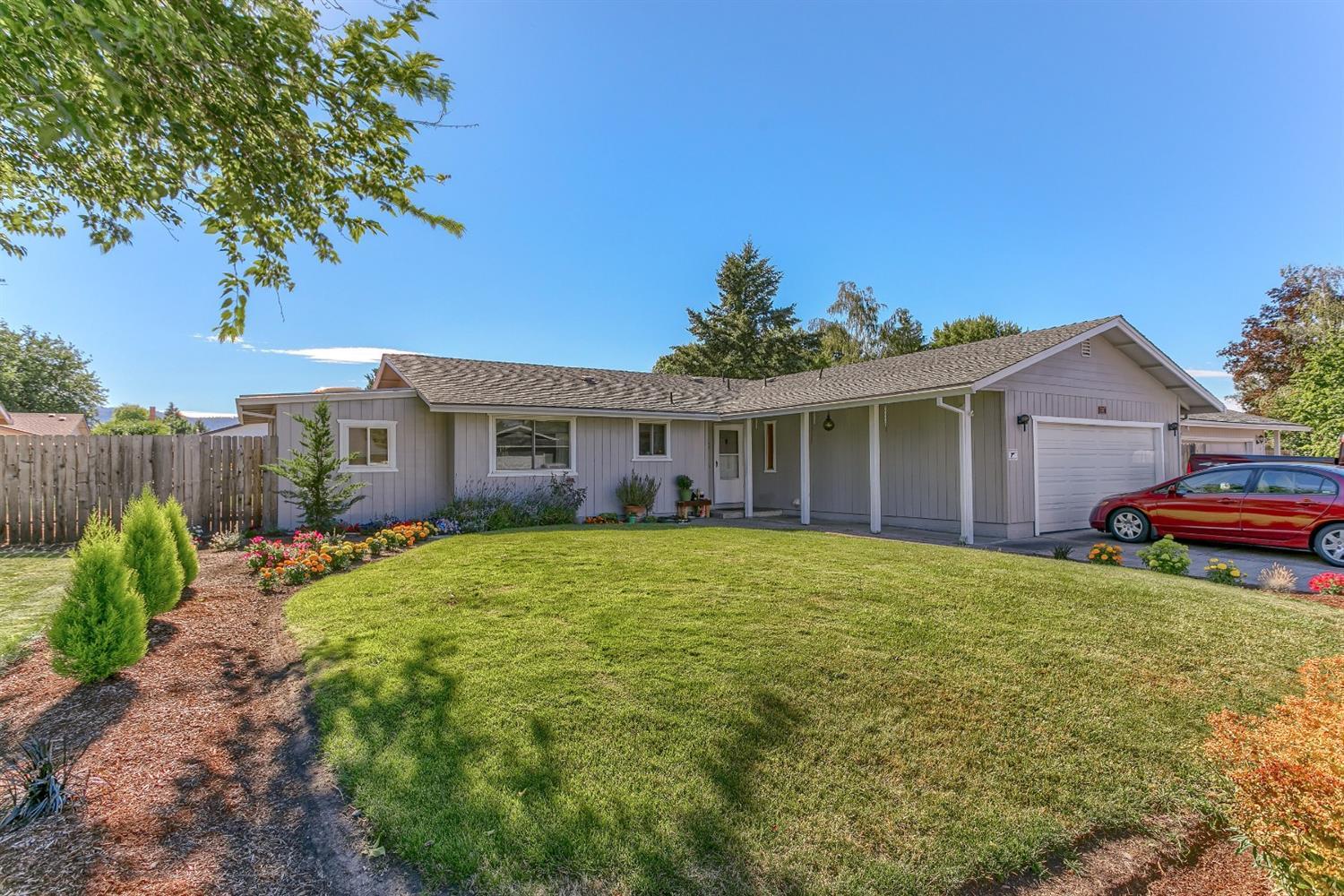 This family home is situated on a large lot allowing for a very nice backyard and is located one block away from a city park with tennis and basketball courts. 4 bedrooms, 2 baths, 1,810 sq. ft. with a large island kitchen. Island has a glass top range and a ton of storage. Floors are tile in the entry, kitchen & dining. Laminate floors grace the living & family rooms. Heat pump is about 5 years old. Located just off Beall Lane this home is conveniently located for easy access to Medford or Central Point. Listing agent is related to seller.