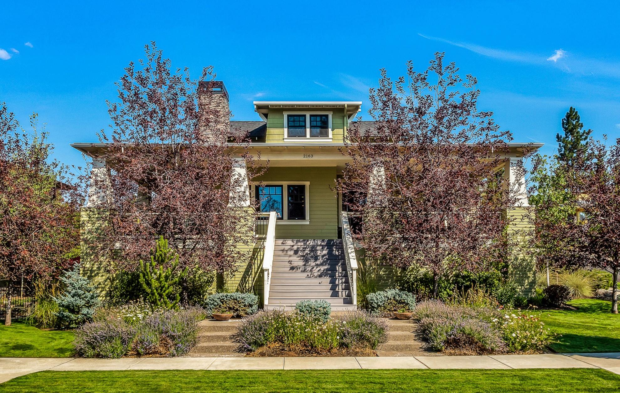 Located on a .25 acre lot on Bend's NW Side in the award winning neighborhood of Northwest Crossing. This beautiful Mission style bungalow with a gracious wrap around deck with full sunny southern exposure, features quality finishes including hardwood floors on the main level, extensive woodwork, kitchen with granite counters, stainless appliances, 6-burner gas cooktop, farmhouse sink, island w/ prep sink, disposal, solid wood cabinets, pot filler and eating bar. Great room, master suite, luxury bath and private office are located on the main floor. Upstairs you will enjoy 3 large bedrooms, storage and a spacious sitting room. Finished daylight basement with one bedroom, bath, family room and private entrance. Storage galore, bring all your toys. Oversized 3 car garage. Close to schools, shops, restaurants, parks, Phil's Trail, Downtown Bend and the Deschutes River. This large warm inviting home will capture your heart as soon as you enter. Don't miss this opportunity!