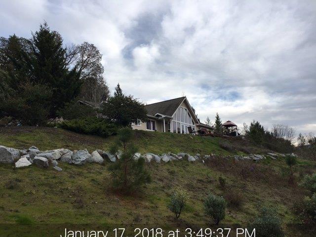 Three bedroom Two bath home. 1556 sq. feet with attached two car garage. 3.56 acres. View property. Steep hillside mostly unusable. On line Auction. Occupied property. Contact with occupants is prohibited. Inspection home not available. Sold AS IS''. No for sale sign. Not a drive by; steep driveway no turn around. BofA employees & employees' household members including persons deriving their primary means of financial support from a Bank employee and business partners of the Bank are prohibited from purchasing this property, whether directly or indirectly. See your Realtor for auction information.