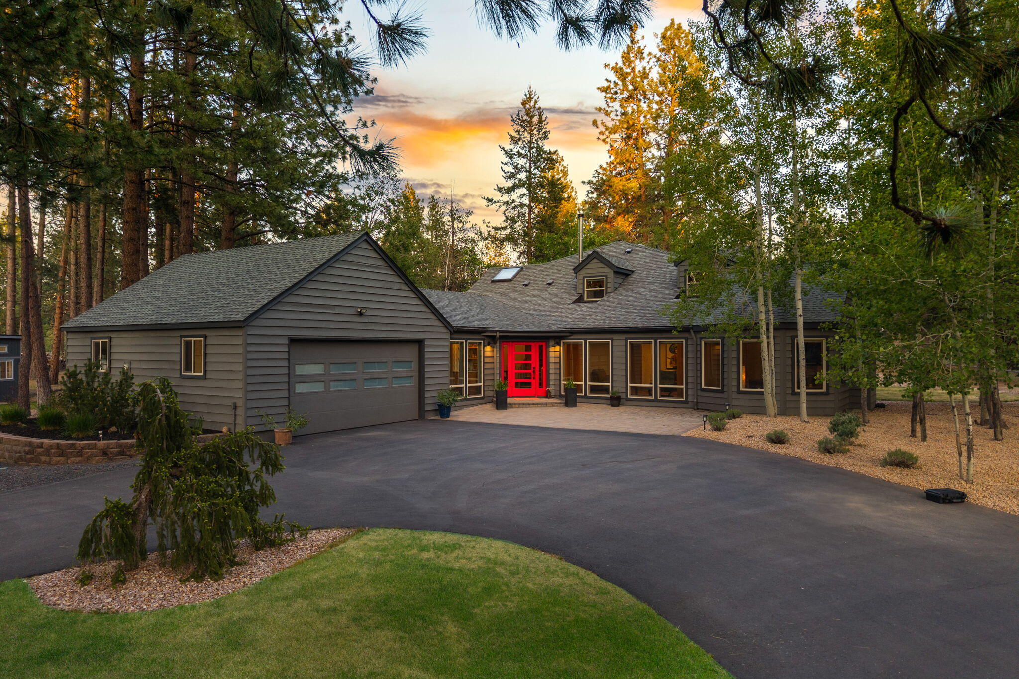 Discover the space and privacy you've been searching for on this stunning 2.84-acre property in Woodside Ranch. Thoughtful and creative renovations throughout the home have transformed into a bright, open layout that seamlessly blends indoor and outdoor living. The spacious living room with a stone fireplace flows into an updated kitchen featuring a breakfast bar and SS appliances and dining area. Downstairs, you'll find two bedrooms and a full bath. Upstairs offers a versatile loft/office space and a private primary suite complete with dual vanities and custom tile shower, walk-in closet and an abundance of storage. Step outside to enjoy beautifully landscaped grounds, a large Trex deck perfect for entertaining, and a relaxing hot tub. The fully fenced property features a gated driveway for added privacy and security, as a barn/shop and a separate 12 x20 artist studio, ideal for creative pursuits or additional workspace.