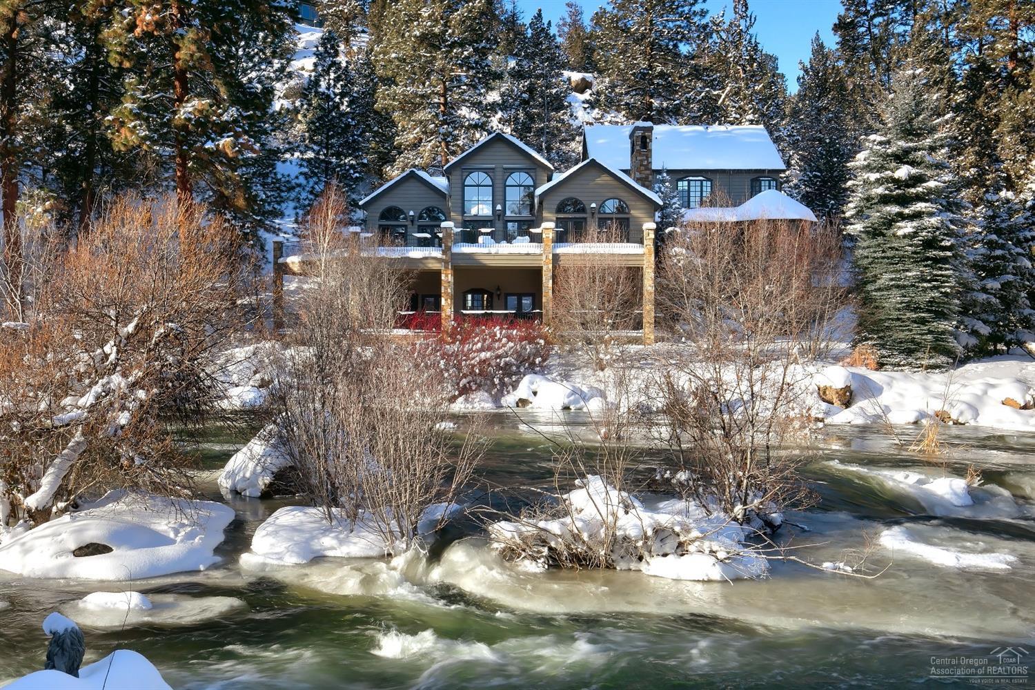 Spectacular riverfront home exudes character & style w/gorgeous slate flooring, warm wood ceilings, graceful arched windows & French doors throughout. Chef's kitchen. Stunning dining. Open great room w/fireplace. Master w/riverfront decking, relaxing bath & two large closets. Office w/private entry & access to full bath. Two bedrooms w/private play space. Guest suite w/views. Separate studio. Expansive decking & beautifully landscaped lawns. Exceedingly rare opportunity right on the Deschutes River in Bend.